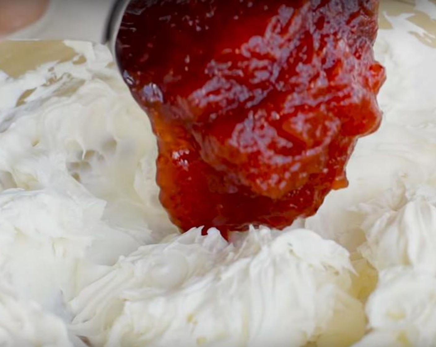 step 1 In a small bowl, combine Cream Cheese (1 cup), Vanilla Extract (1/2 tsp) and beat until is smooth. Add Strawberry Jam (1/4 cup) and continue to mix until well incorporated. Add  Fresh Strawberry (1/3 cup) and Lemon (1/2). Mix together with spatula. Transfer filling to a piping bag or ziplock and set aside until ready to use.