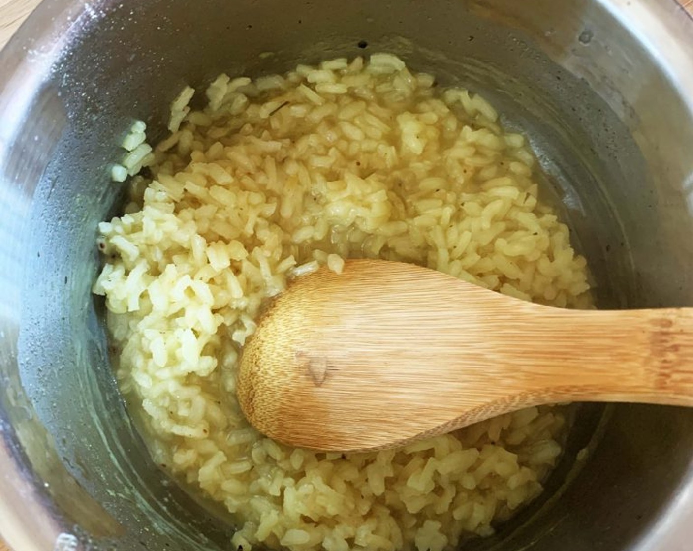 step 2 Add the Arborio Rice (1/3 cup) and toast it on medium-low until translucent.
