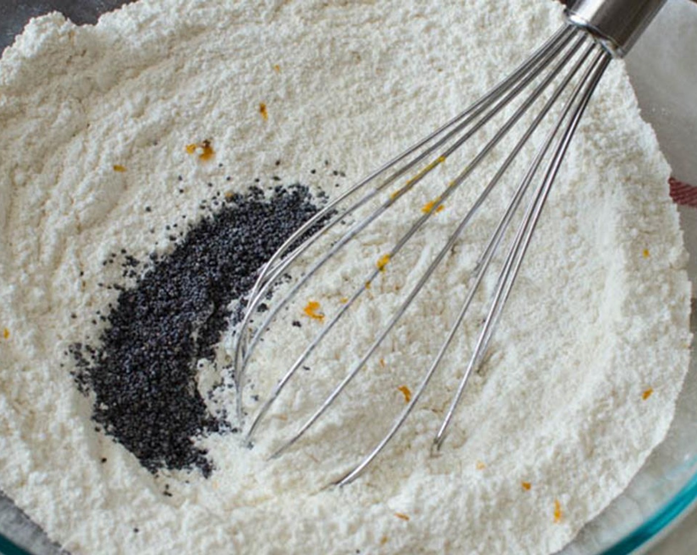 step 1 Preheat the oven to 425 degrees F (220 degrees C). Spray mini muffin tins with vegetable spray. Set aside. In a medium bowl, whisk All-Purpose Flour (2 cups), Granulated Sugar (1/2 cup), Baking Powder (1 Tbsp), Salt (1/2 Tbsp), and Poppy Seeds (1 Tbsp).