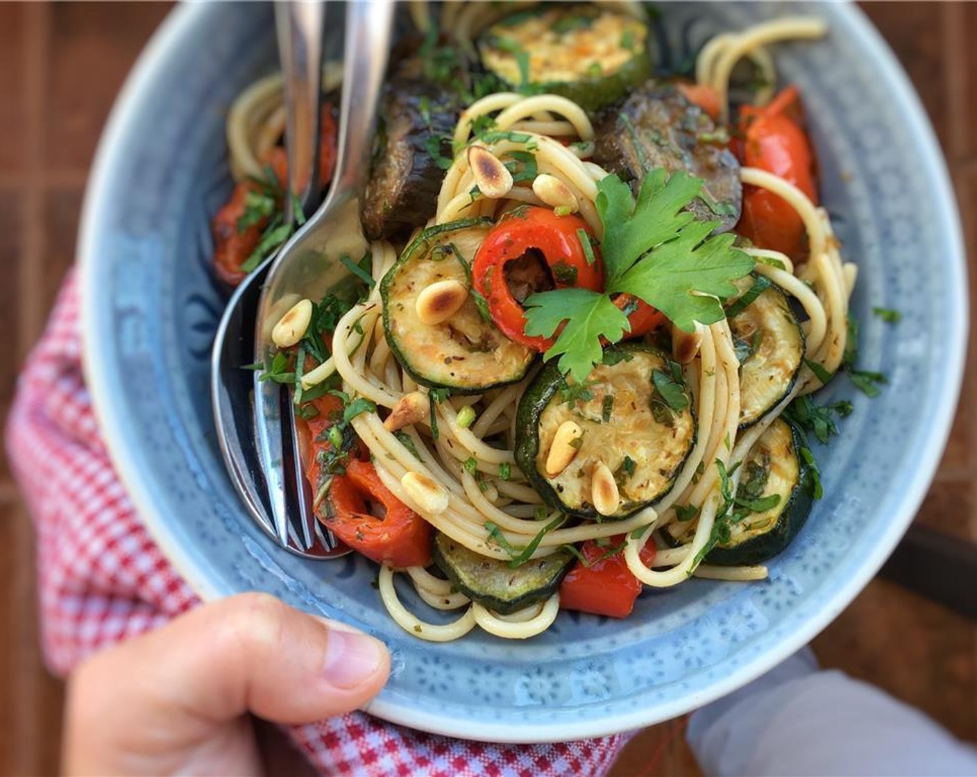 step 9 Then divide the pasta and vegetables over deep plates. Sprinkle with the Pine Nuts (2 Tbsp).