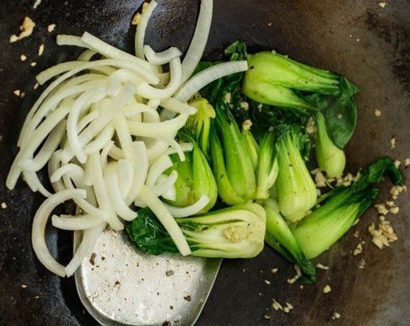 step 6 Add the Onion (1) and stir fry until just before the onion softens.