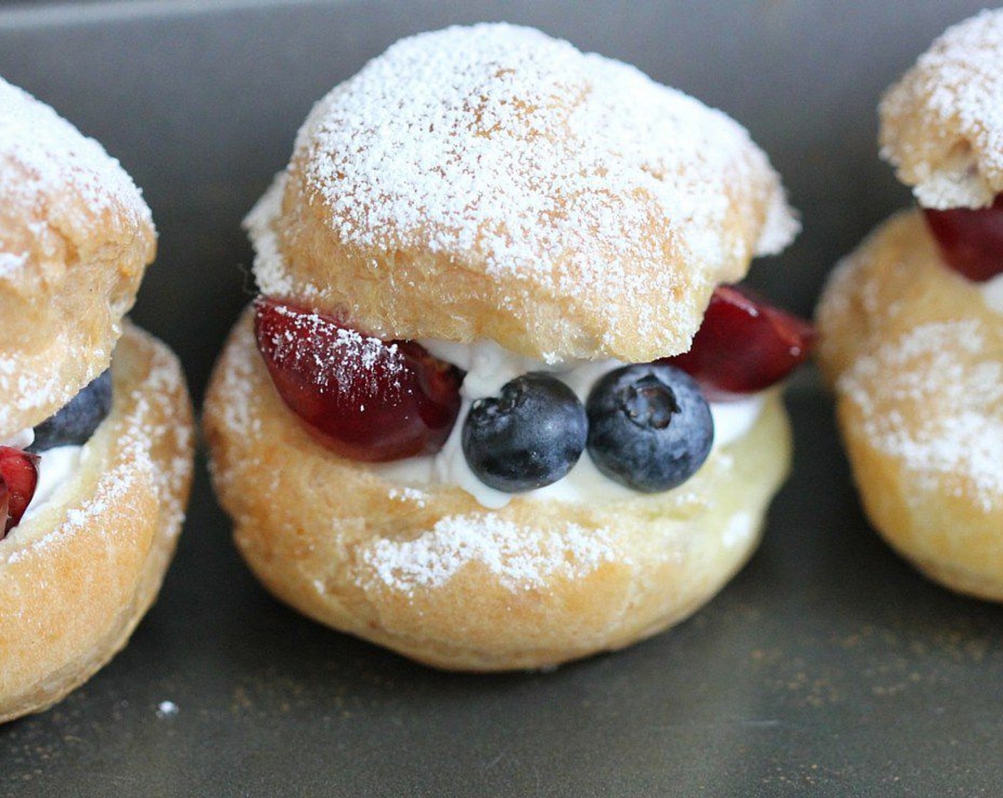 step 12 Cut the top off each choux pastry and fill the bottom halves with whipped cream and your favorite seasonal Fresh Fruits (to taste). Place the other half on top and dust with additional Powdered Confectioners Sugar (1 Tbsp). Enjoy!