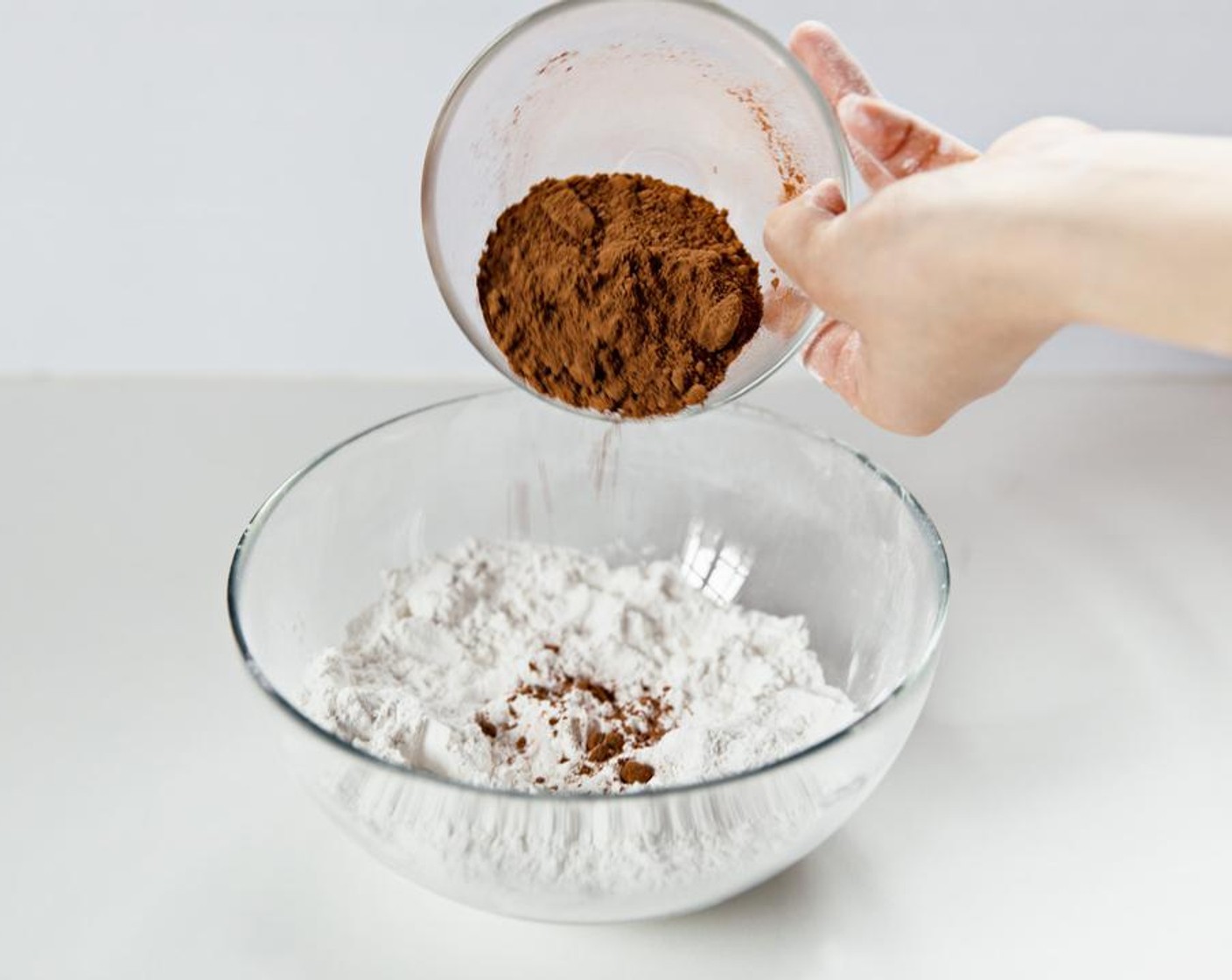 step 5 In a bowl, combine Water (to taste), Sweet Glutinous Rice Flour (1 2/3 cups) and Unsweetened Cocoa Powder (1 cup).