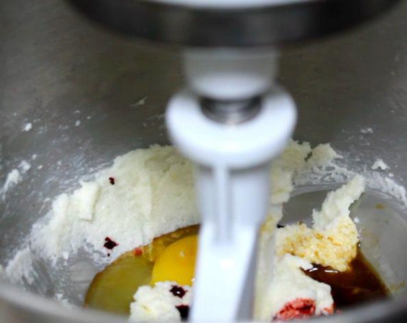 step 1 In the bowl of a stand mixer, add Granulated Sugar (1 cup) and Butter (2/3 cup) and mix until smooth. Add Farmhouse Eggs® Large Brown Egg (1), Vanilla Extract (1 tsp), and Red Food Coloring (1 Tbsp). Mix again until combined.