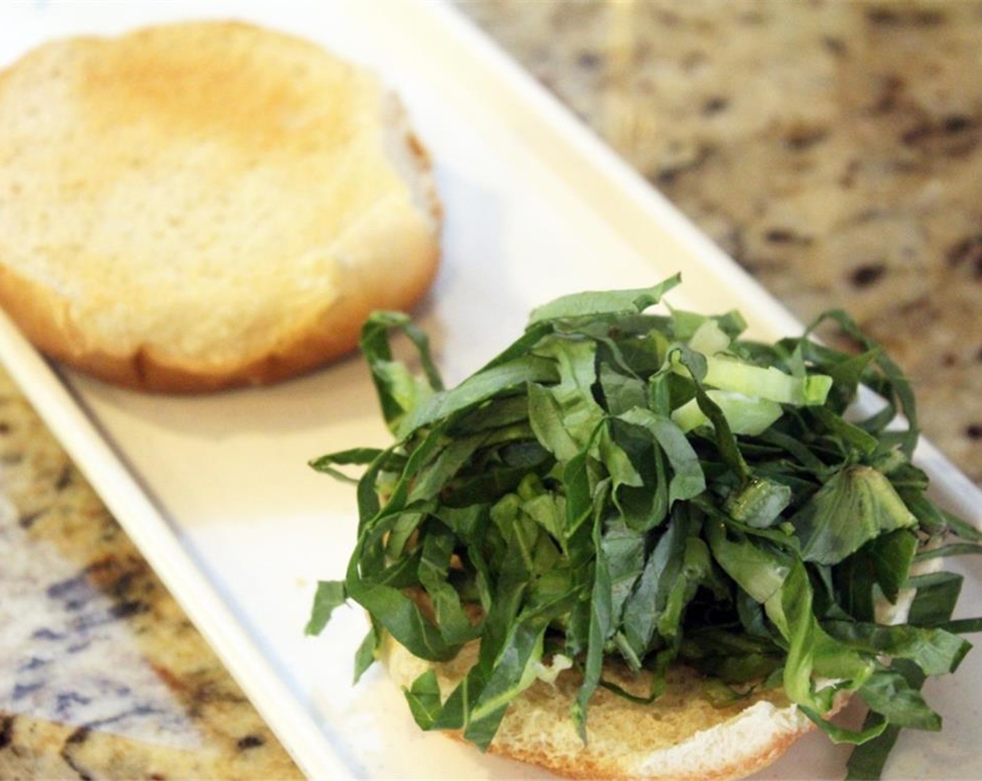 step 6 To serve, pile some 2Lettuce (1 cup) on the bun bottoms.