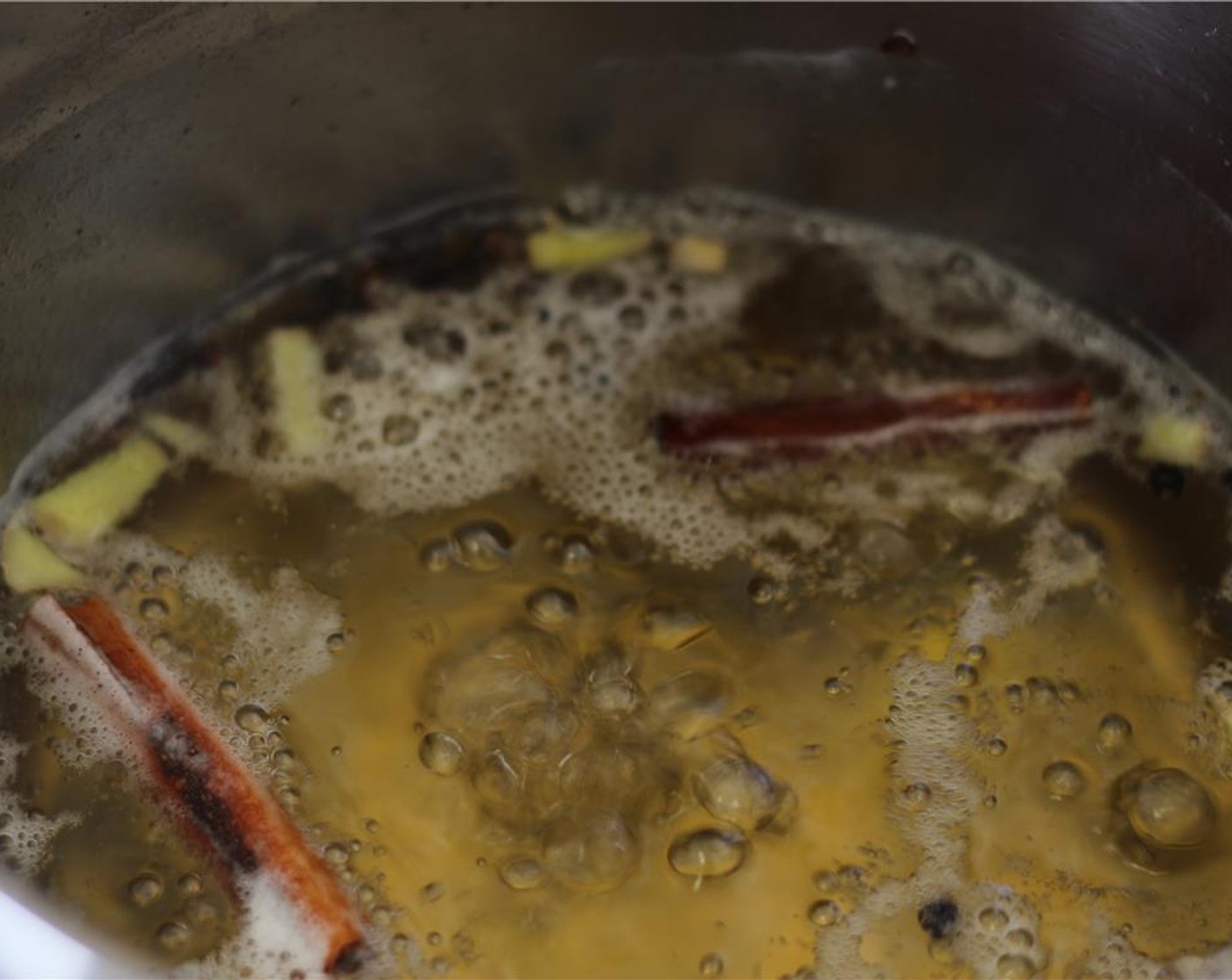 step 1 Bring the Sweet Wine (2 1/3 cups), Granulated Sugar (1 cup), Honey (1/2 cup), Fresh Ginger (1 1/2 Tbsp), Whole Cloves (10), Peppercorns (10) and Cinnamon Stick (1), and place in a pot large enough to hold the pears over high heat.