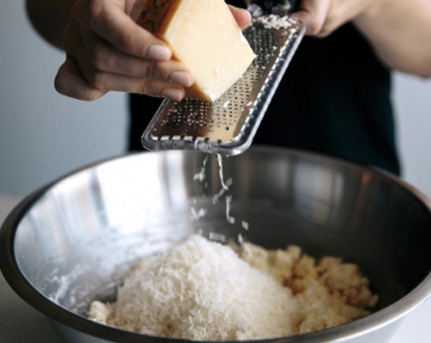 step 5 In a medium mixing bowl, add the Ricotta Cheese (2 1/2 cups), finely grated Parmesan Cheese (1/2 cup), Eggs (2), Ground Nutmeg (1/2 tsp), some Sea Salt (to taste) and Freshly Ground Black Pepper (to taste), and mix with a fork to combine.