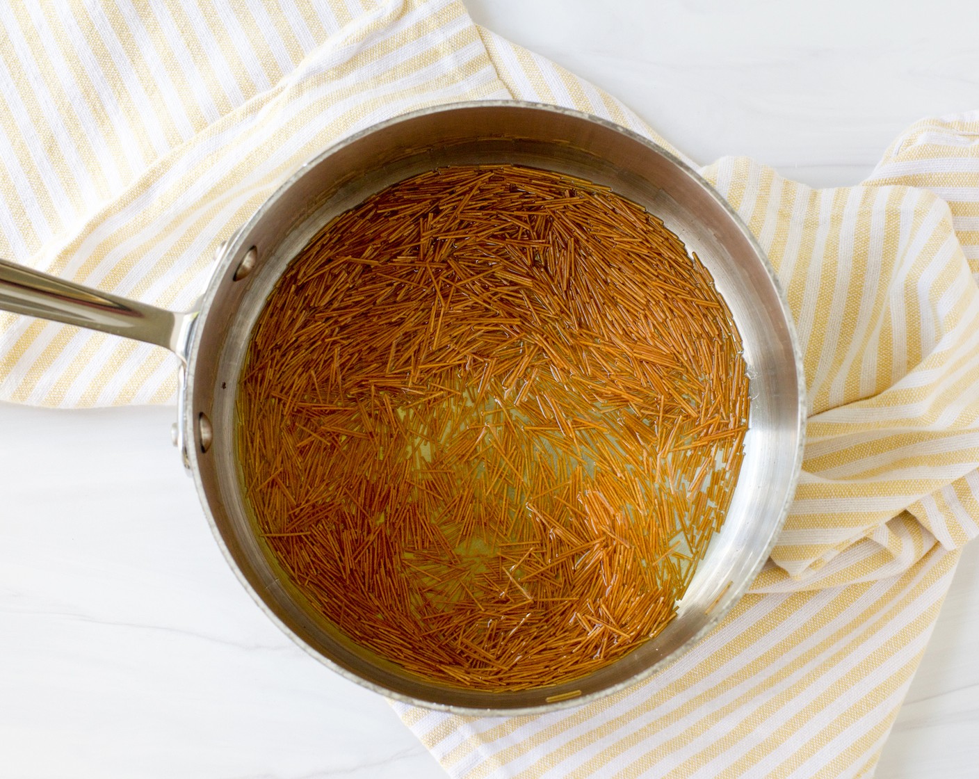 step 1 Add the Ghee (3 Tbsp) to a medium saucepan and heat over medium heat until melted. Add the Vermicelli Noodles (1/2 cup) and toast, stirring frequently, until golden brown, 2 to 3 minutes.