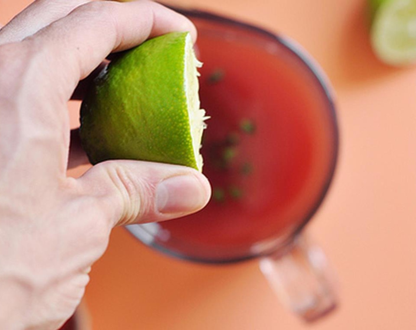 step 9 Juice the Limes (3) directly into the pitcher and give it a big stir.