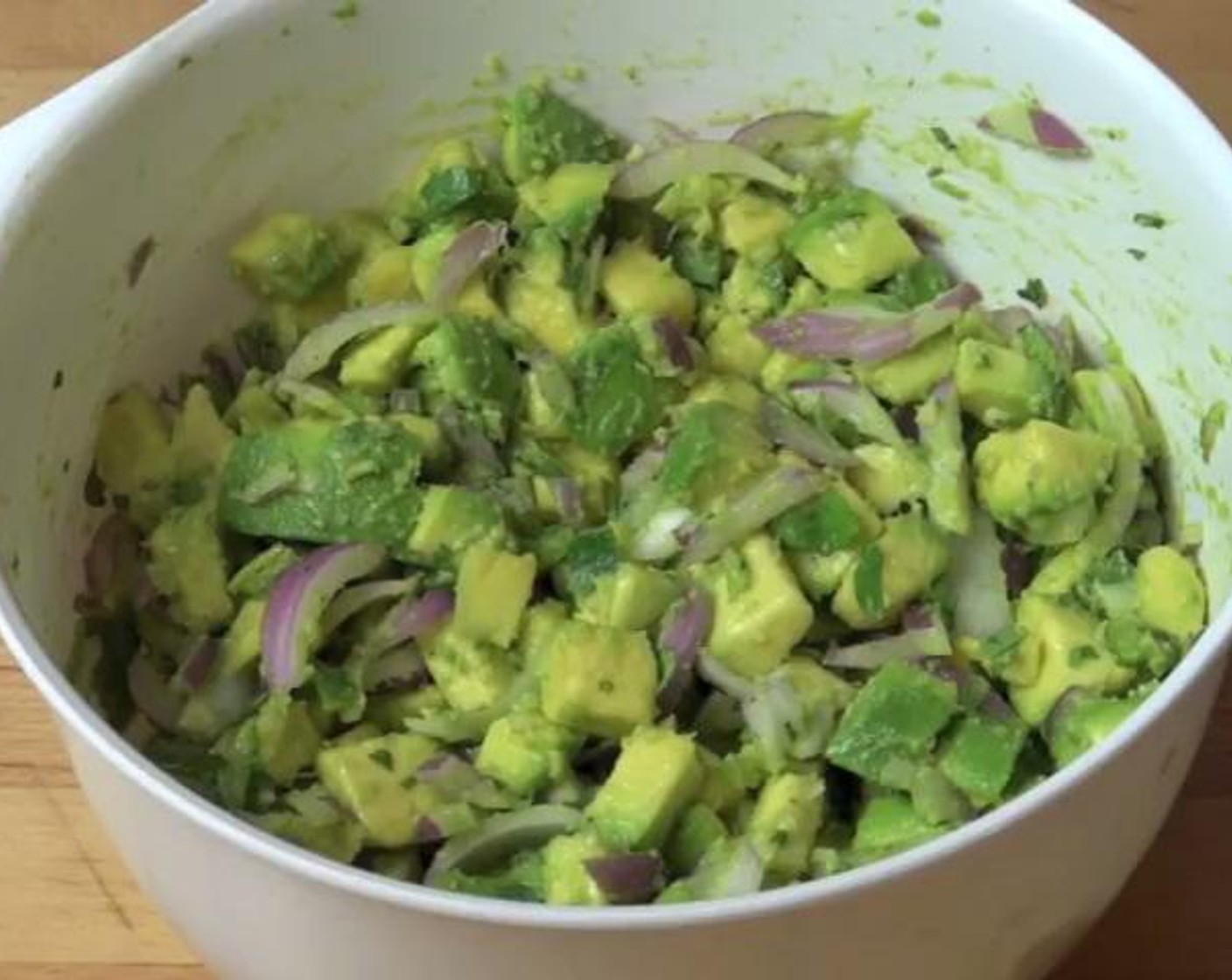 step 1 Into a mixing bowl, add your Avocados (4) chopped Red Onion (1), Garlic (1 clove), Green Bell Pepper (1), Fresh Cilantro (2 Tbsp), Sun-Dried Tomatoes (2 1/4 cups), and Salt (to taste), Freshly Ground Black Pepper (to taste) and mix everything with a good stir.