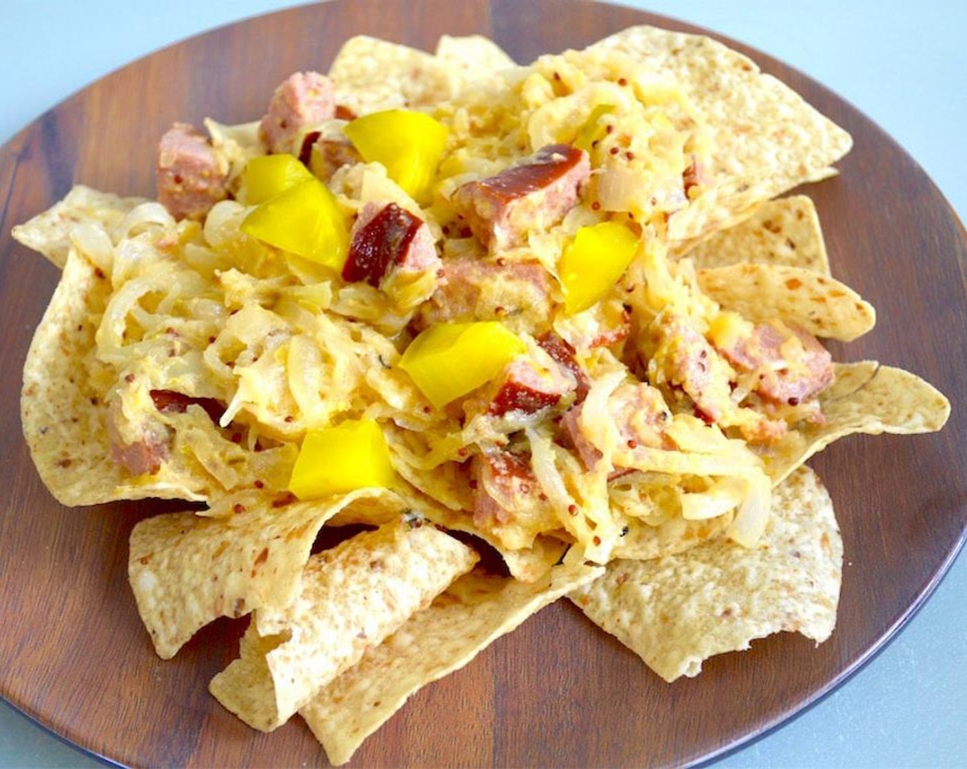 step 7 Fill a platter or separate plates with Tortilla Chips (15 1/4 cups) as desired, then pile generously with the kielbasa mixture. Top the nachos with the Kosher Dill Pickle Spears (4). Serve and enjoy!