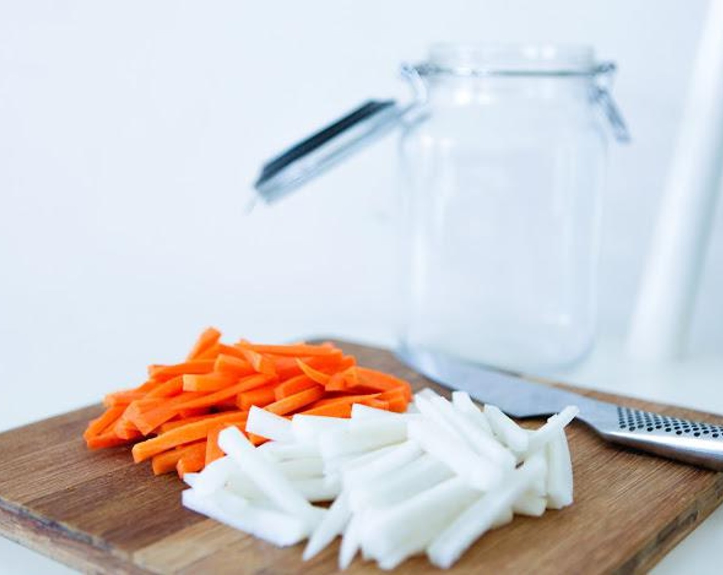 step 2 Place the Carrots (2 1/4 cups) and Daikon Radishes (2 1/4 cups) in a large mixing bowl and add the Sea Salt (1 1/2 Tbsp) and Raw Sugar (2 Tbsp). Massage for about 10 minutes to dissolve the salt and sugar and bring out some of the liquids from the vegetables.