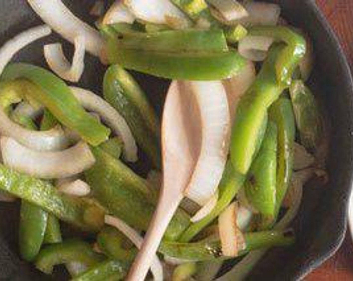 step 5 Cook White Onion (1/2) and Green Bell Pepper (1) in separate pan with a little oil for about 1-2 minutes- veggies should still be firm and not soggy.