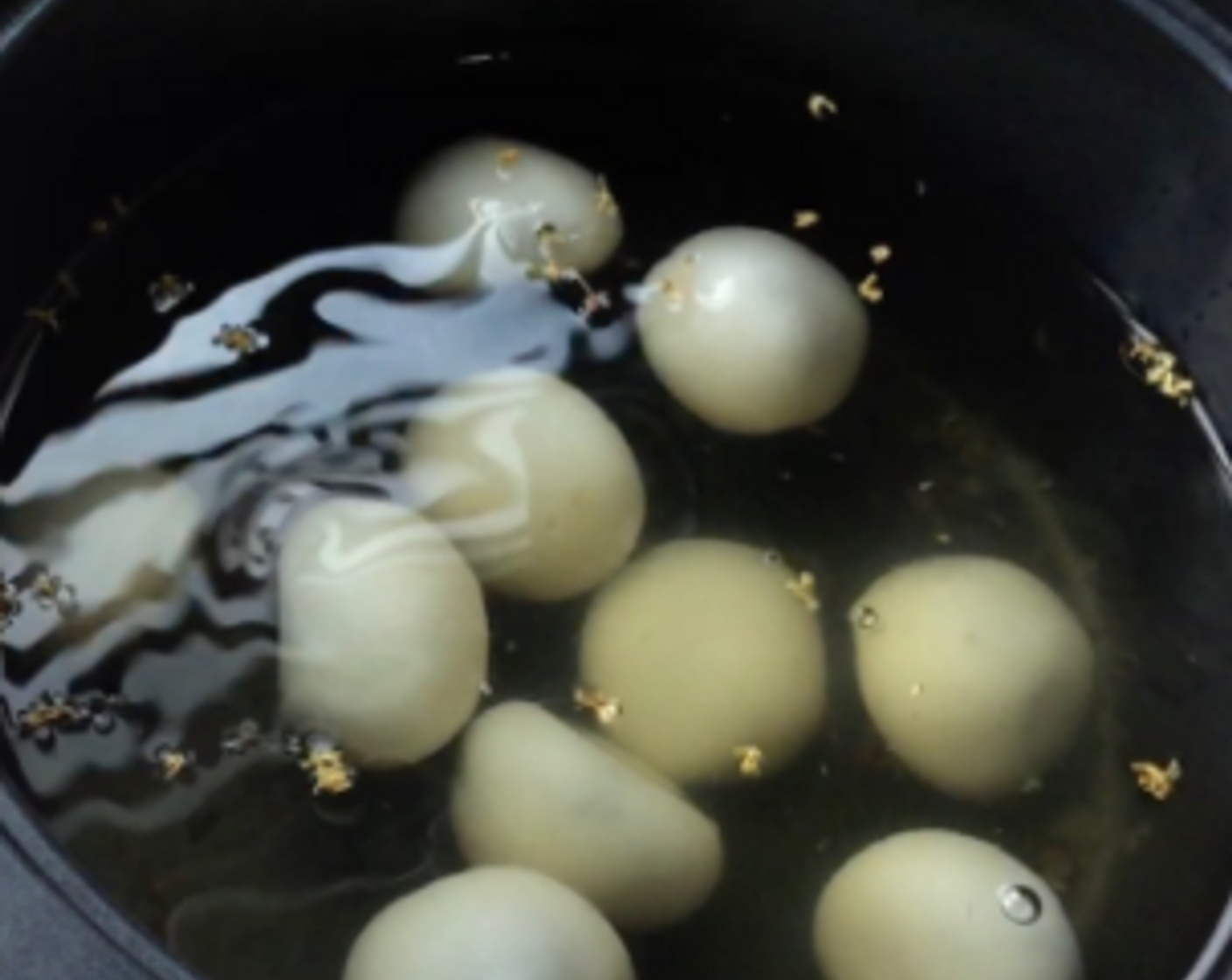 step 26 Then place the glutinous rice balls into the pot of ginger syrup prepared earlier. And we're done!