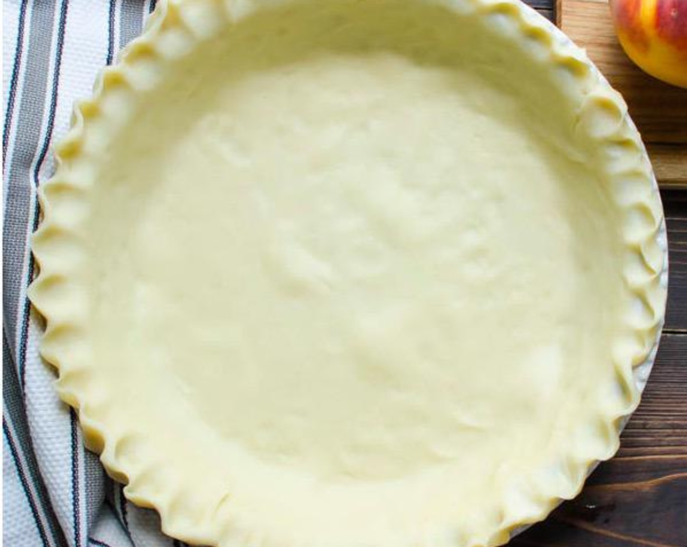 step 5 Shape edges of crusts with your fingers by pinching your thumb and index finger together on the outside of the crust and using your other index finger to press the pastry into the wedge between your pinched fingers.