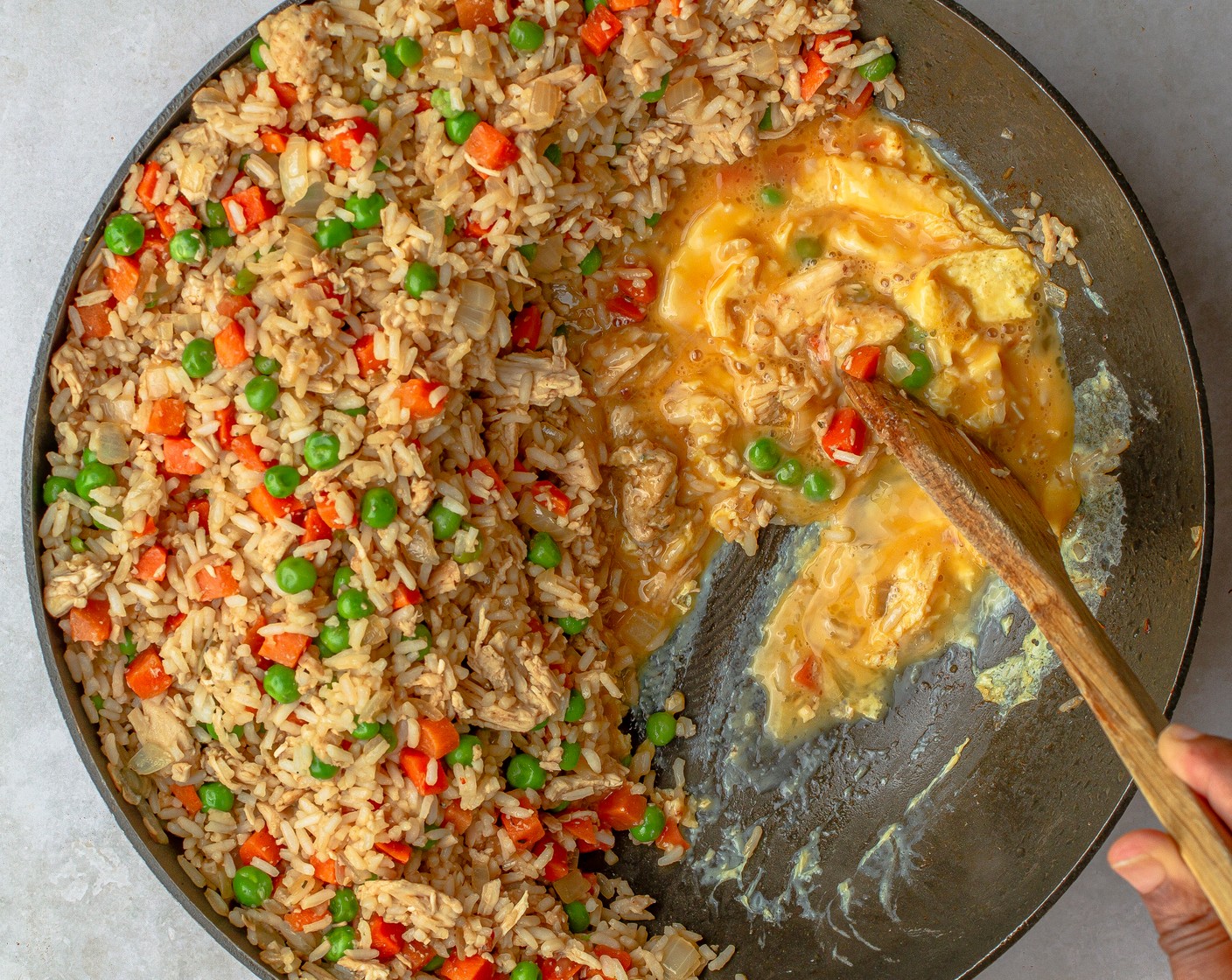 step 4 Reduce the heat to medium, and push the rice to one side of the wok. Spray the open side of the pan with cooking spray and add the Farmhouse Eggs® Large Brown Eggs (3) to the empty side. Let sit 30 seconds or until eggs start to set around the edges, then gently scramble until cooked for 1 to 2 minutes. Stir to combine with the rice.