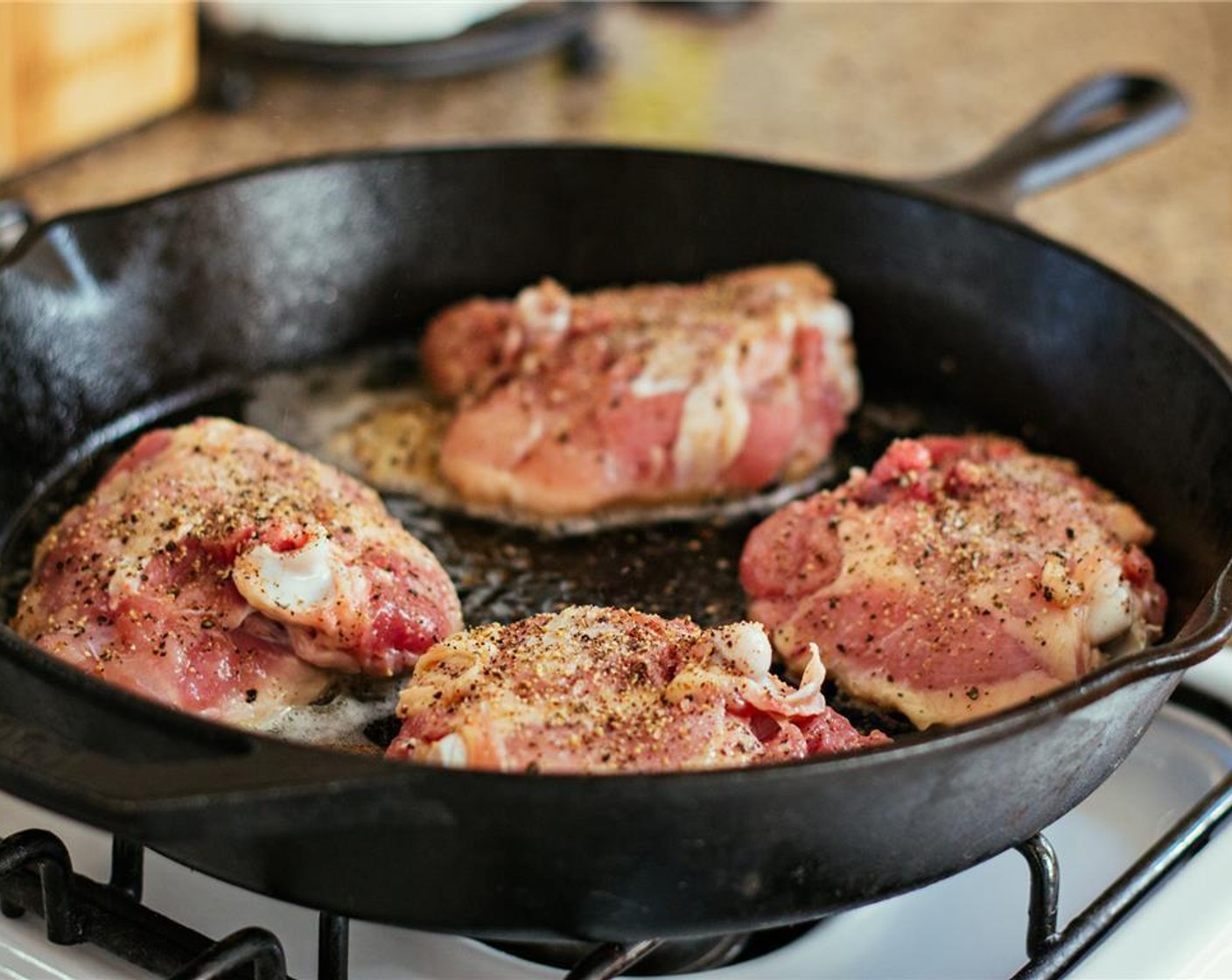 step 6 Place the chicken in the skillet skin side down and cook without moving for 30 minutes.