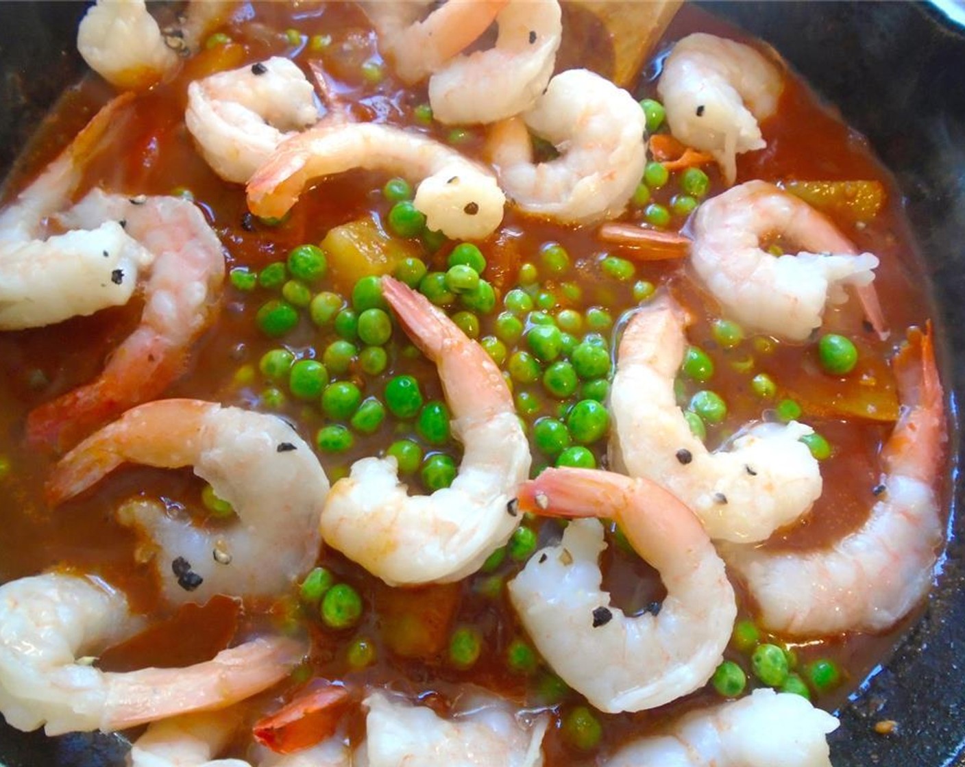 step 8 Add the shrimp and Green Peas (1/2 cup) to the tomatoes. Mix and check and adjust seasoning.