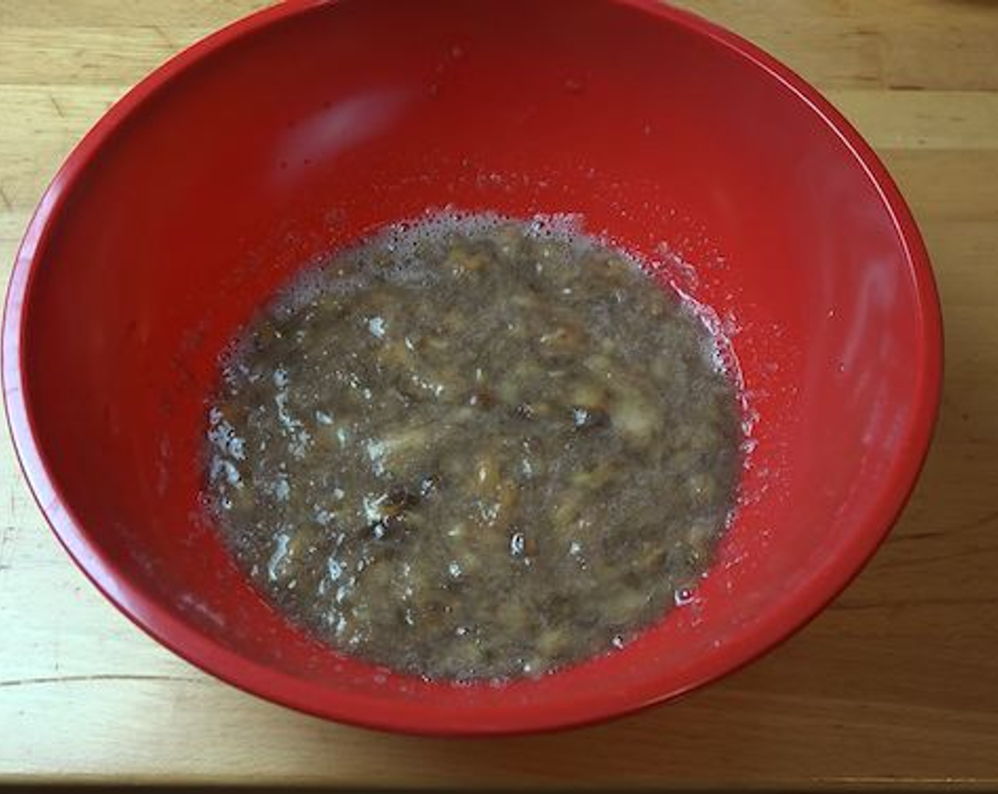 step 2 In a large mixing bowl add Bananas (5) and mash them up with a fork.