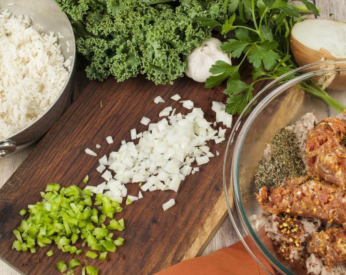 step 5 In a large bowl combine Ground Turkey (1 lb), Ground Italian Sausages (13 oz), White Onion (1/2 cup), Green Bell Pepper (1/2 cup), Garlic (4 cloves), Italian Flat-Leaf Parsley (1 Tbsp), Dried Oregano (1/2 tsp), Dried Basil (1/2 tsp), Salt (to taste), Ground Black Pepper (1 tsp), and Crushed Red Pepper Flakes (1/4 tsp). Mix gently just to combine all ingredients. Gently mix in rice.