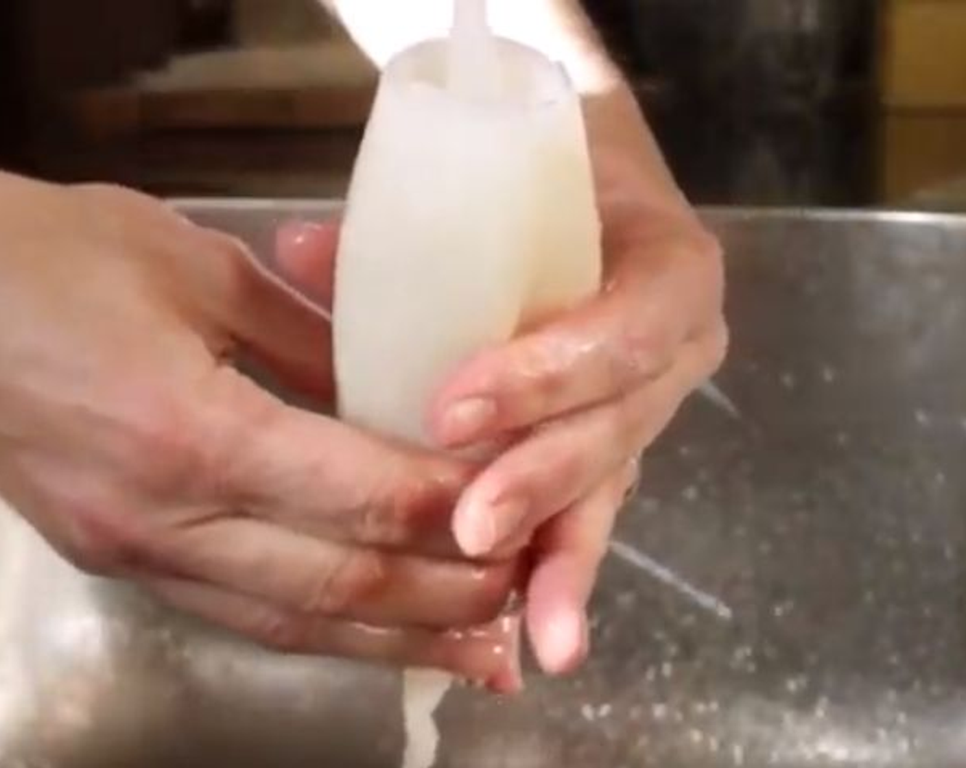 step 1 Grab Frozen Squid Tubes (2) and rinse under cold running water, making sure to rinse out the inside of the body. Pat dry with paper towels.