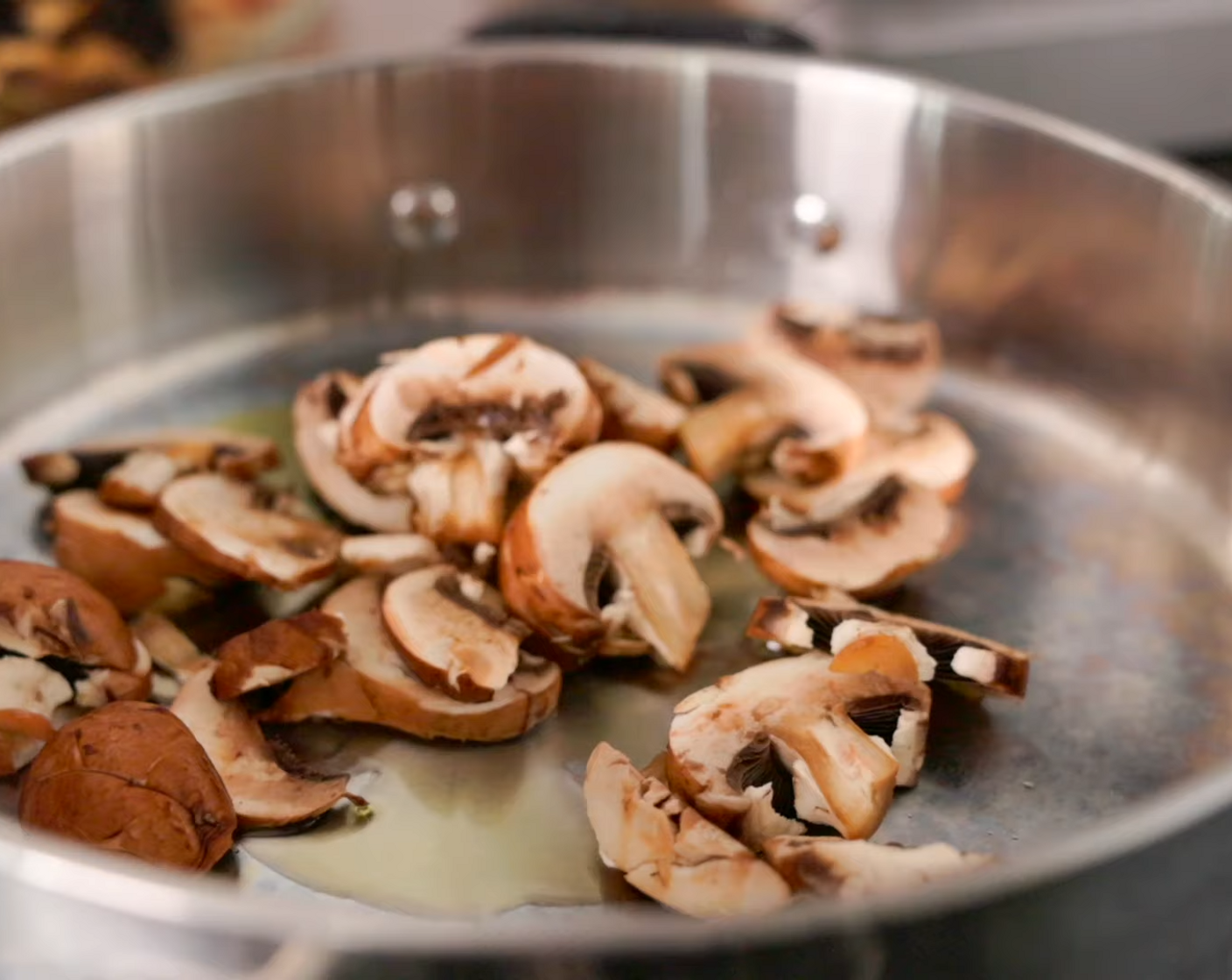step 6 Heat Extra-Virgin Olive Oil (2 Tbsp) over medium heat in a large frying pan. Add Cremini Mushroom (1 cup) and sauté for a few minutes.