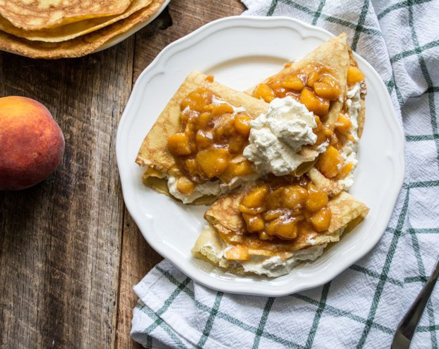 step 13 Top with the cooked peach sauce and additional goat cheese whipped cream. Serve with a light drizzle of Peach White Balsamic Vinegar (to taste) and Maple Syrup (to taste).