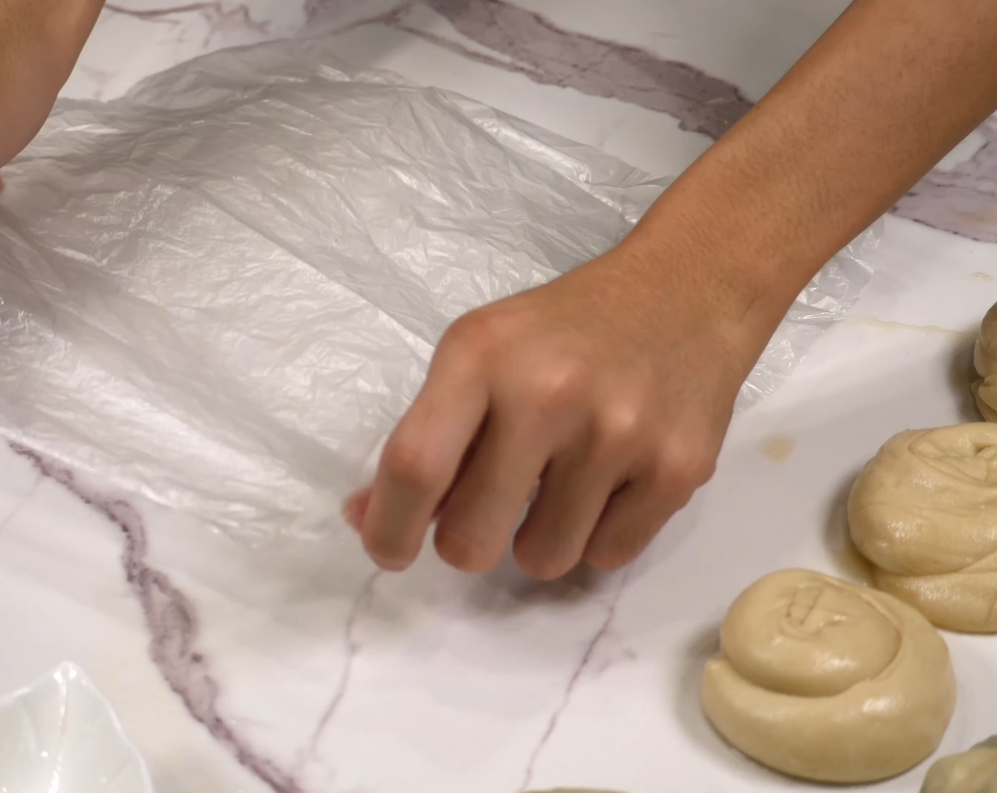 step 10 Prepare two pieces of plastic or parchment paper that have been greased with some oil.