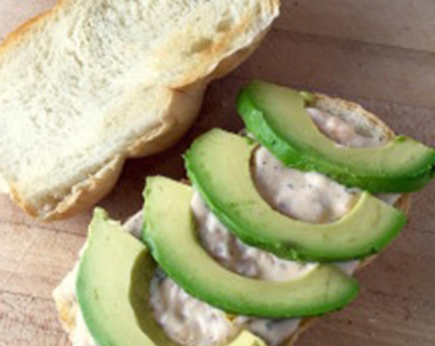step 2 Toast the Sandwich Rolls (2) then spread liberally with the mayo and top with Avocado (1/2).