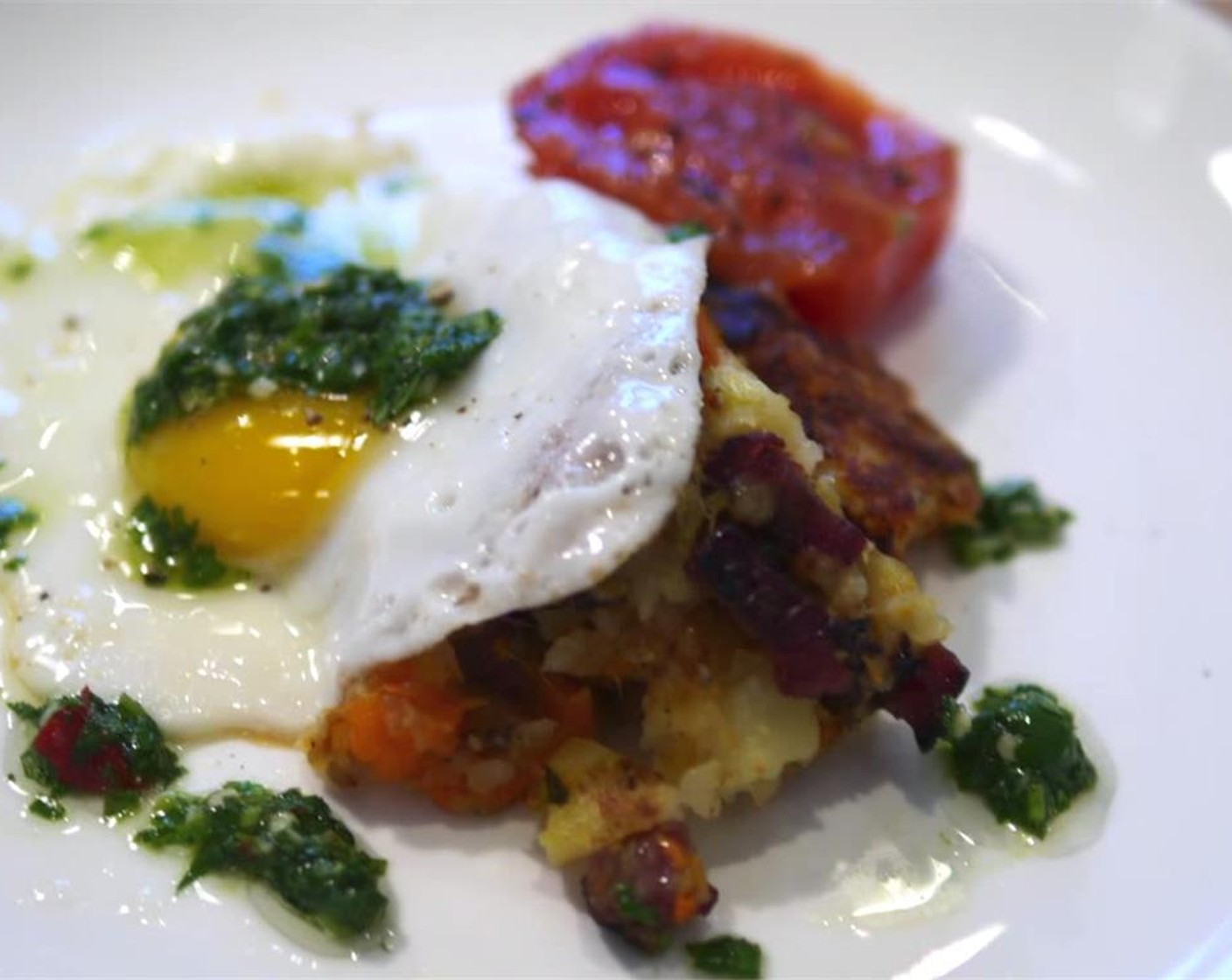 step 5 Halve the Tomatoes (2) and fry them with the Eggs (4) sunny side up. Scoop the bubble and squeak onto a plate, top with the egg, and serve the tomatoes on the side. Enjoy!