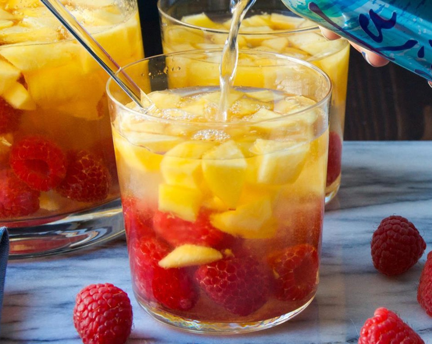 step 5 Add ice to glasses and pour in the sangria - making sure to get several spoonfuls of fruit in each glass. Top with a splash of Club Soda (to taste).