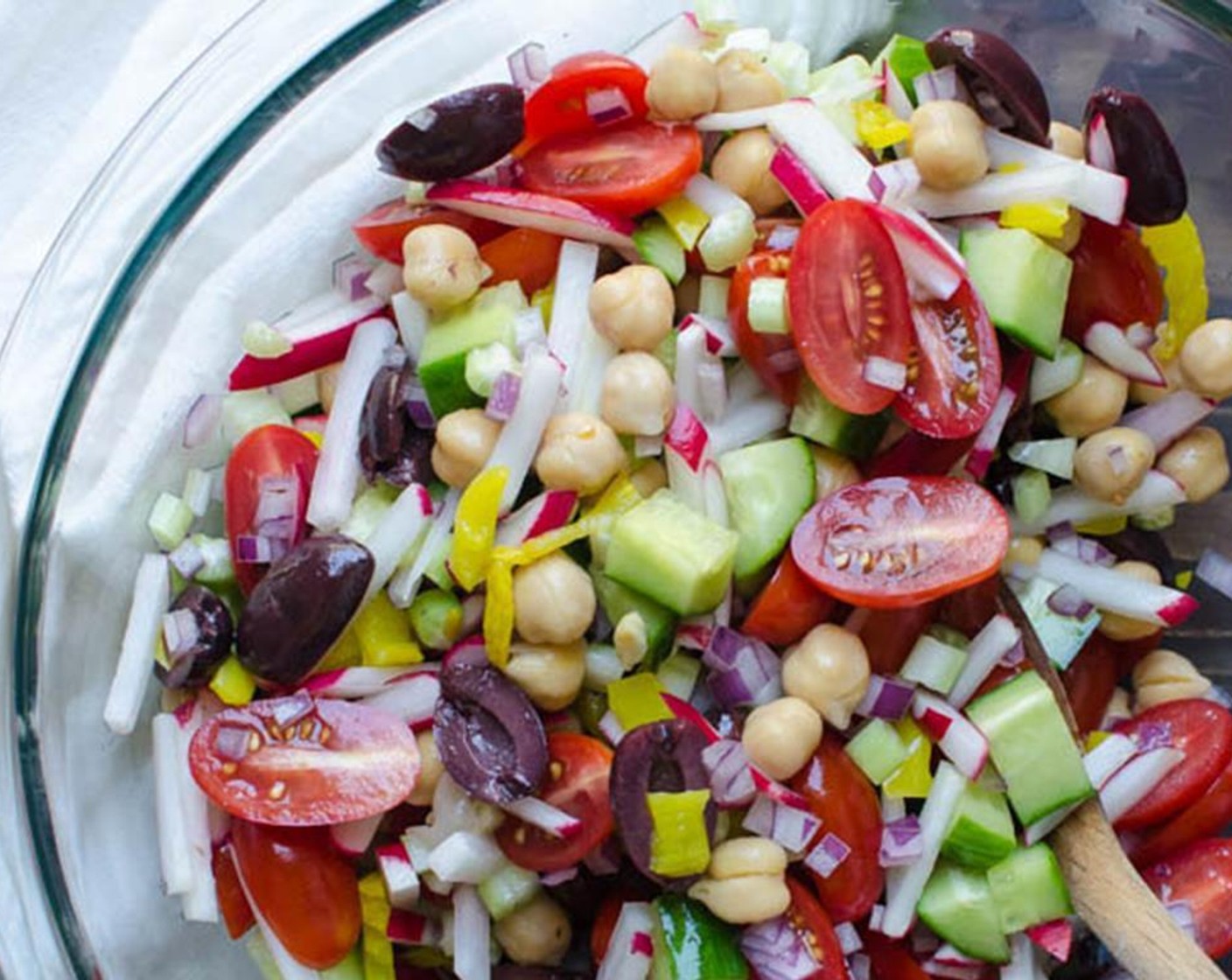 step 2 Meanwhile, add Kalamata Olives (1/2 cup), Celery (1/2 cup), Red Onion (1/3 cup), Pepperoncini Pepper (1/2 cup), Canned Chickpeas (1 cup), Grape Tomatoes (1 cup) and Radish (1/2 cup) in a large bowl.