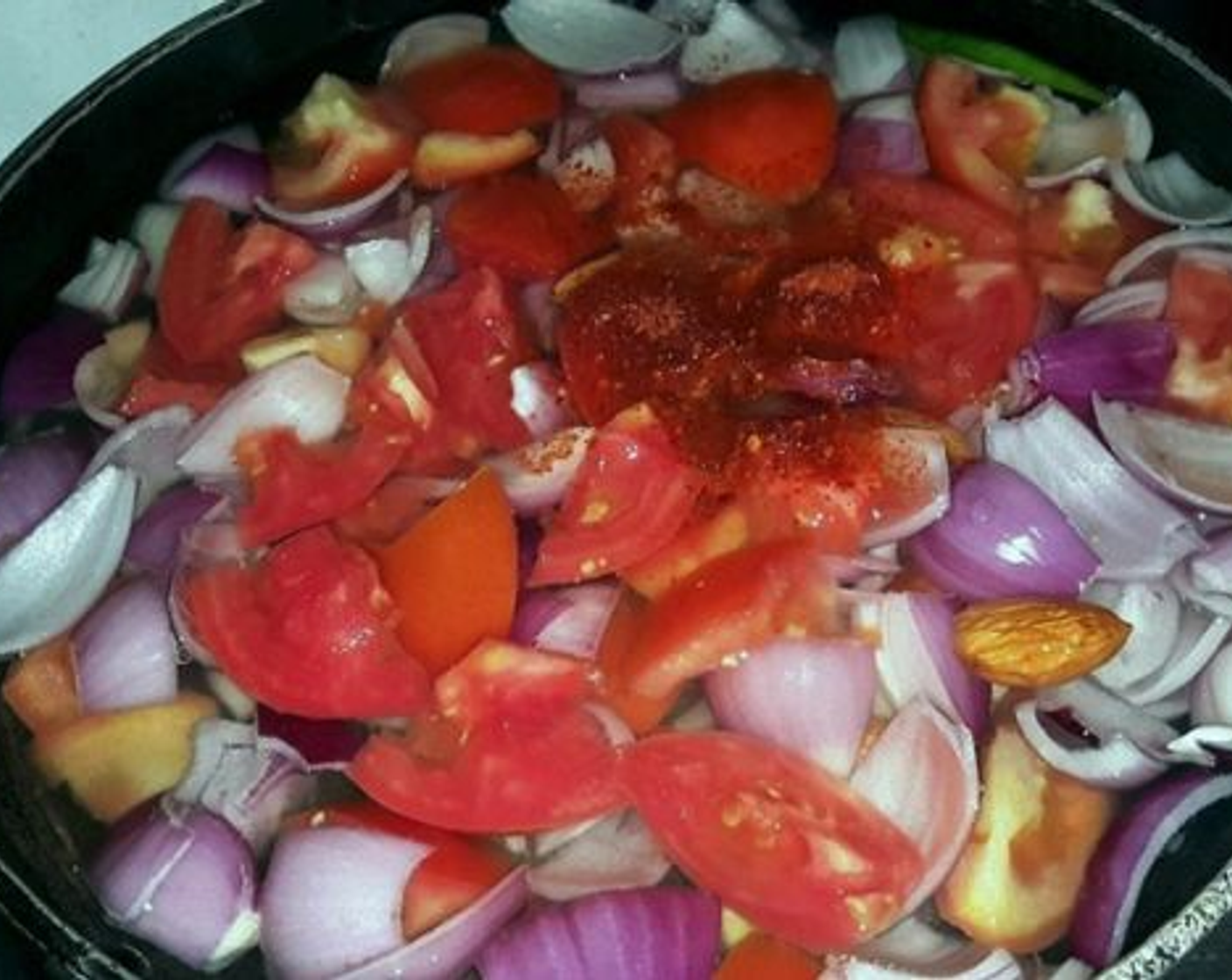 step 1 Take Water (to taste) in a pan, add Onions (2), Tomatoes (3), Fresh Ginger (1 Tbsp), Garlic (4 cloves), Butter (1 tsp), Red Chili Powder (1 tsp), Bay Leaf (1), Cinnamon Stick (1/2 in), and Green Chili Pepper (1).