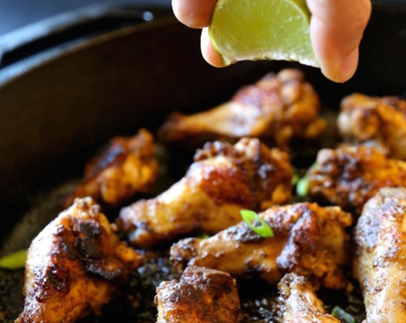 step 6 Remove from oven and sprinkle wings with Scallions (to taste) and lime juice. Serve family-style​.