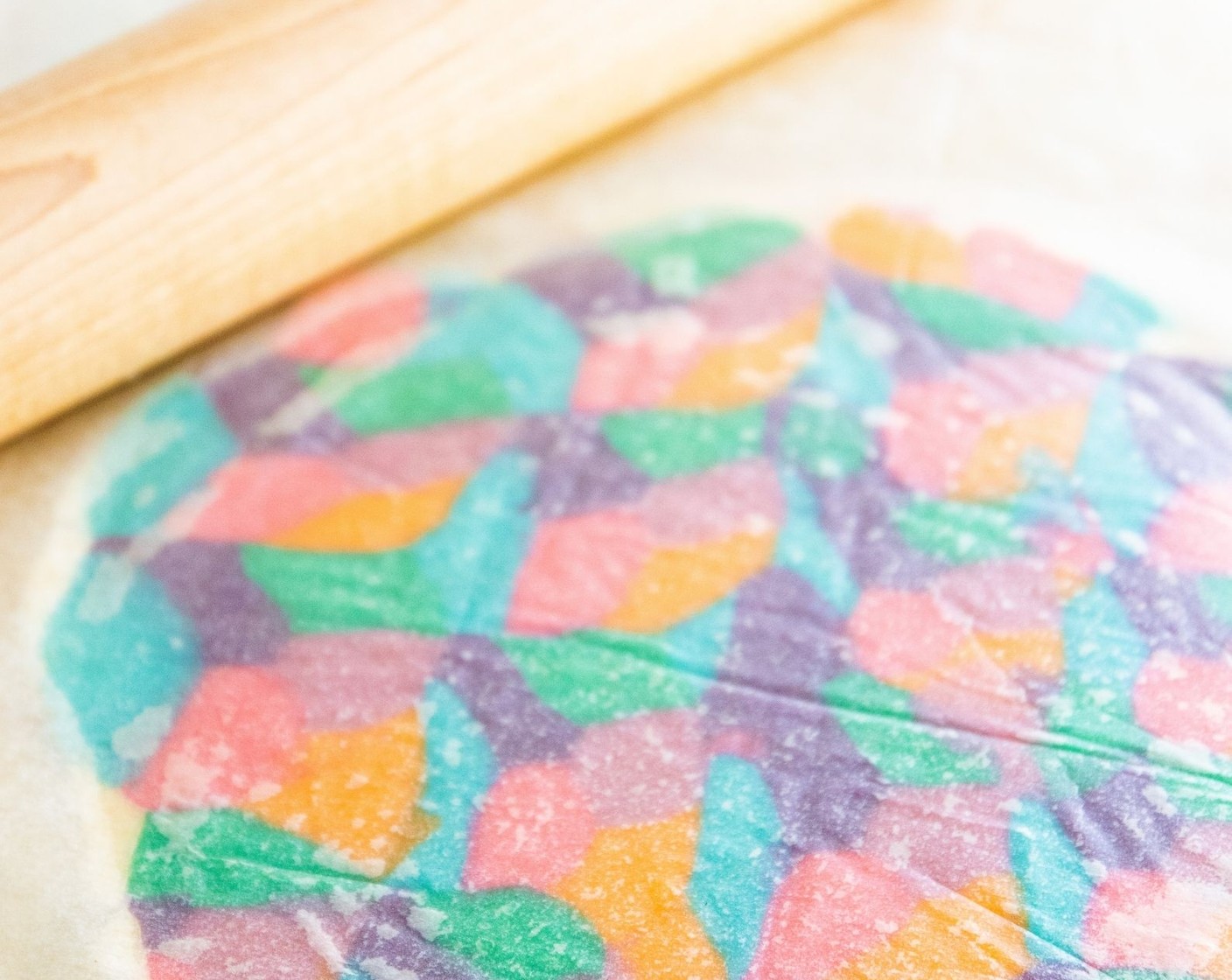 step 11 Place parchment paper on top and gently roll the dough out until it is 1/4-inch thick. Place in the freezer for 5 minutes.