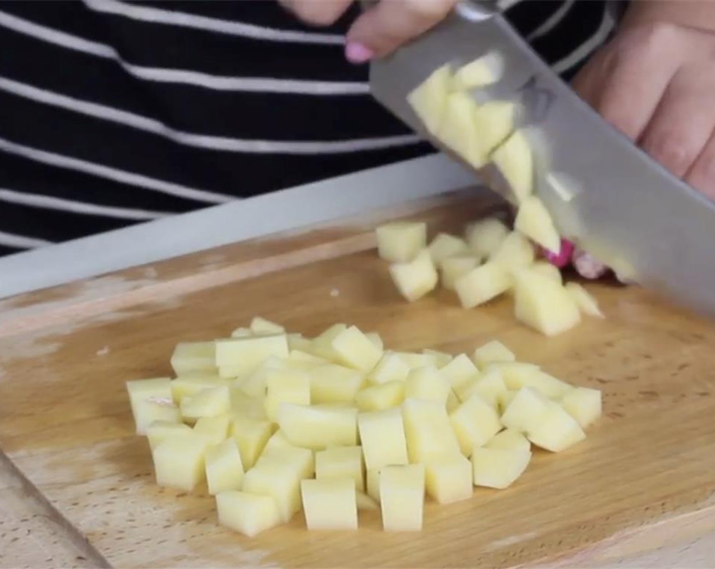 step 3 Peel and dice your Onion (1). Keep in a bowl of water to prevent from browning while preparing the corn.