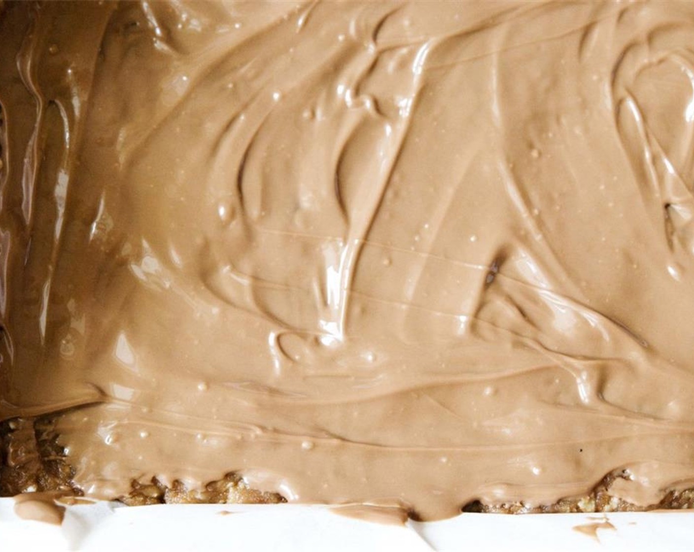 step 8 Spread the melted chocolate on top, then put the whole pan in the freezer for about 30 min.