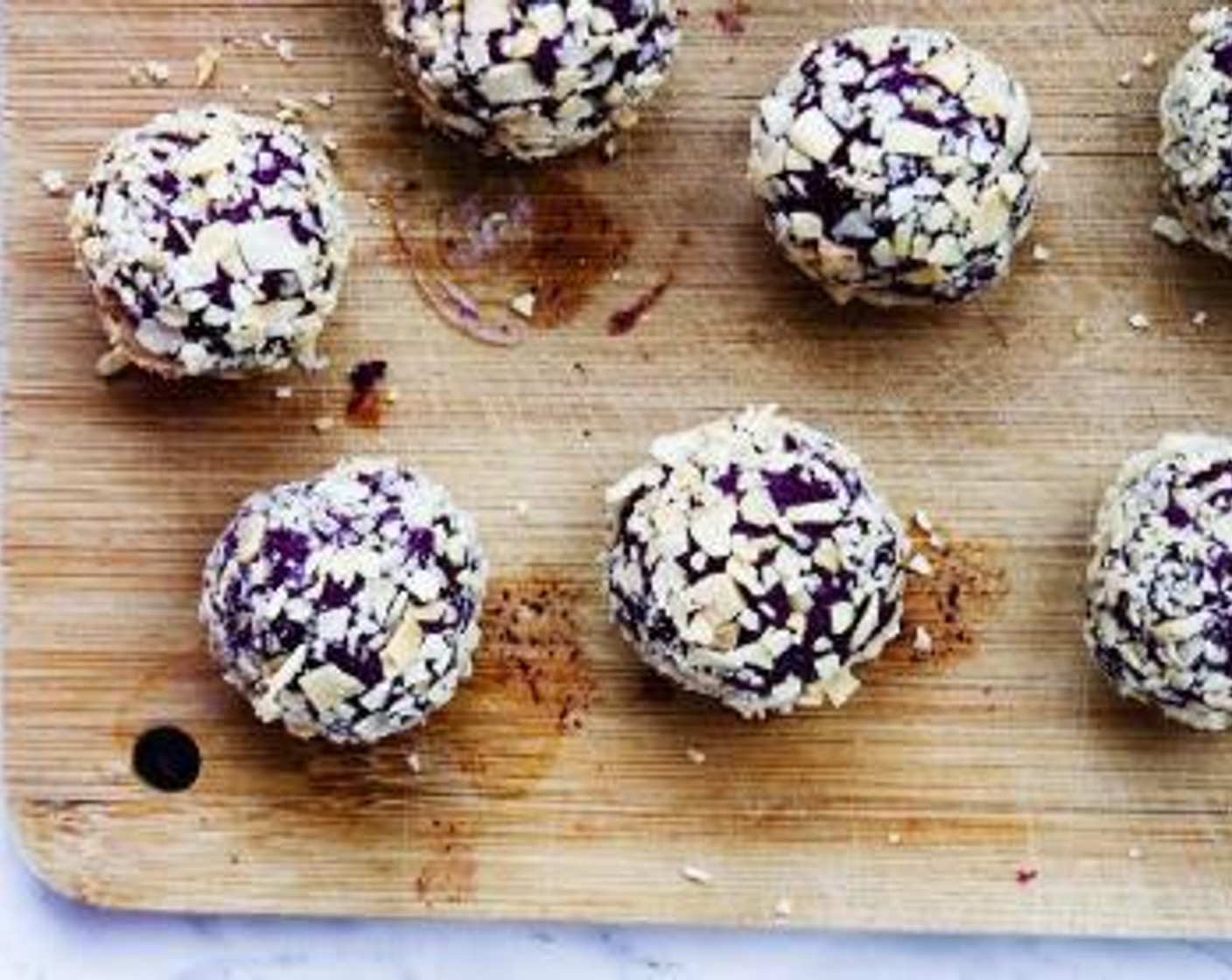 step 3 Then roll mixture into ping-pong size balls and coat them into the coconut chips to make a nice crust.