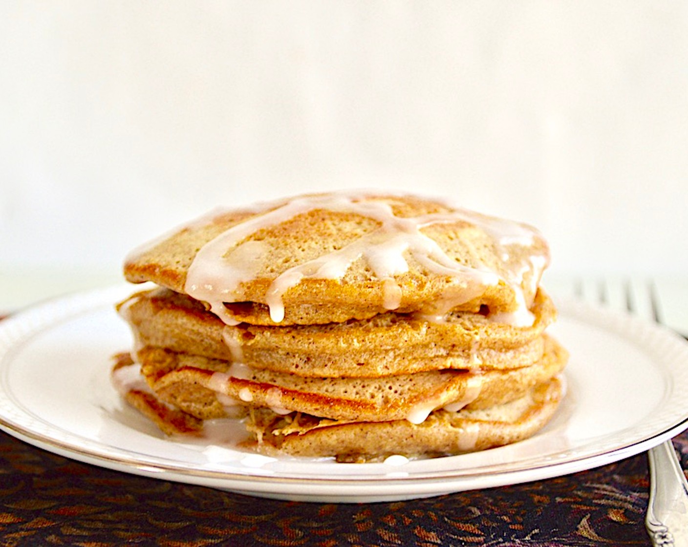 step 7 Plate the pancakes as you finish cooking them with a big drizzle of the icing on top.