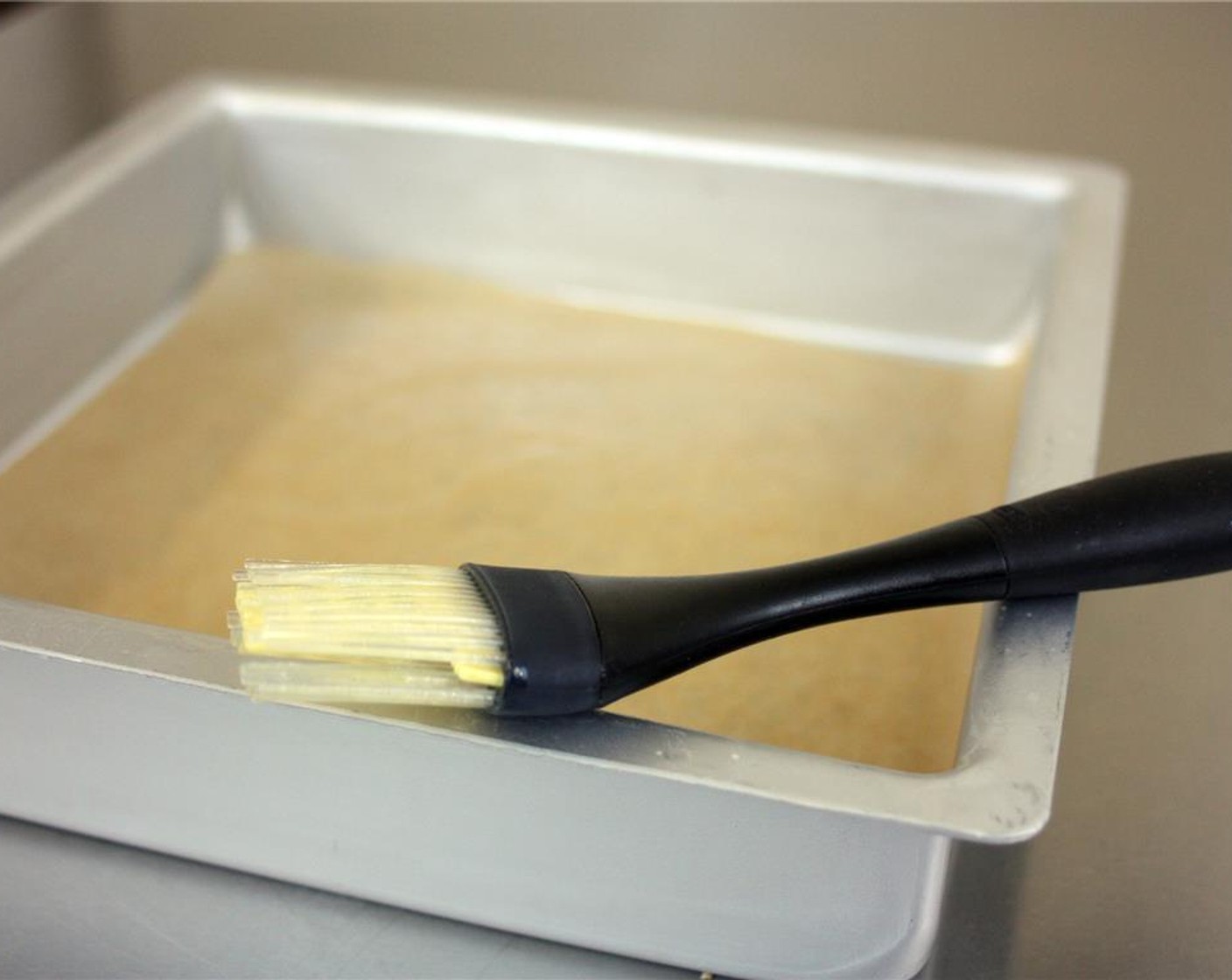 step 2 Grease and line a 9x9 inch pan with parchment paper (you can use an 8x8 inch pan as well, the brownies will just come out thicker).