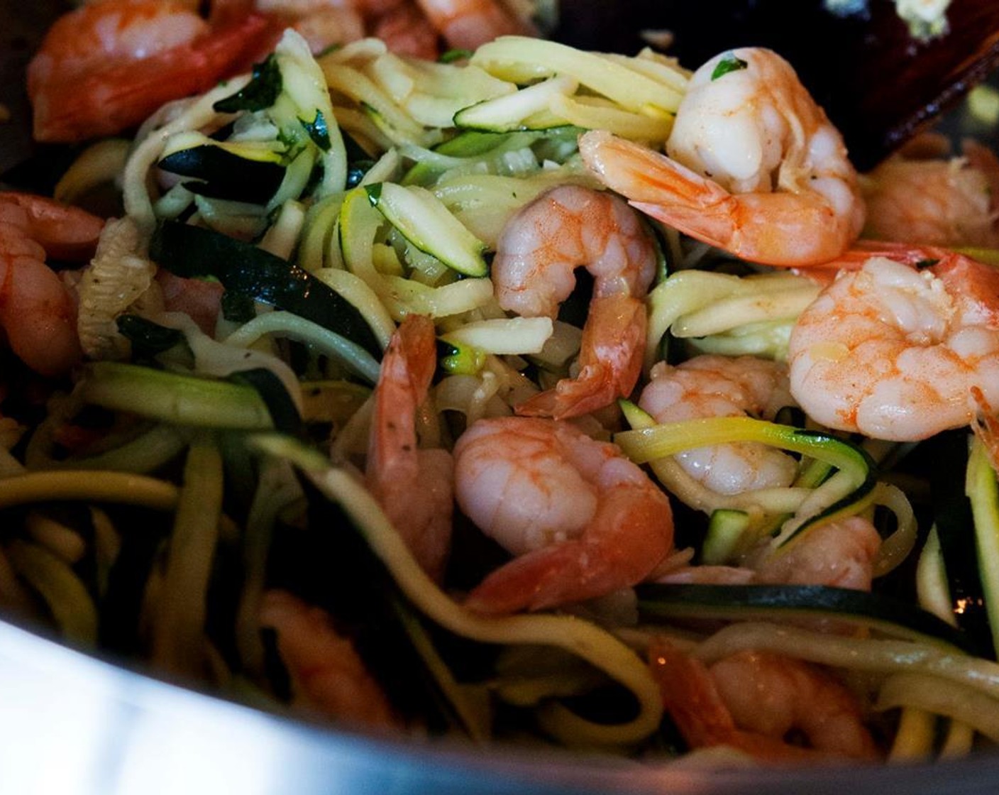 step 7 Add the zucchini noodles to the shrimps and stir on low heat for a few minutes. You want the zucchini to be slightly cooked but not smashed.