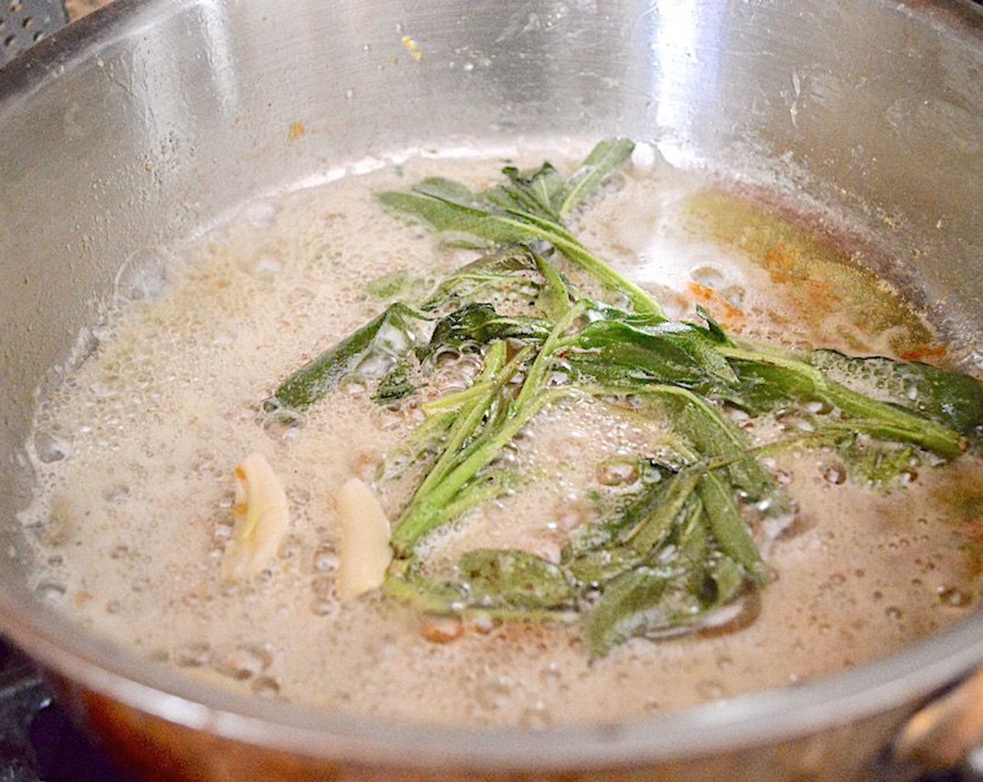 step 9 Add the Butter (4 Tbsp) to the skillet along with the Fresh Sage (1 bunch) and Garlic (2 cloves). Let the sage and garlic fry in the butter for another 3-4 minutes until the sage leaves are crisp. Transfer sage on a plate and discard the garlic.