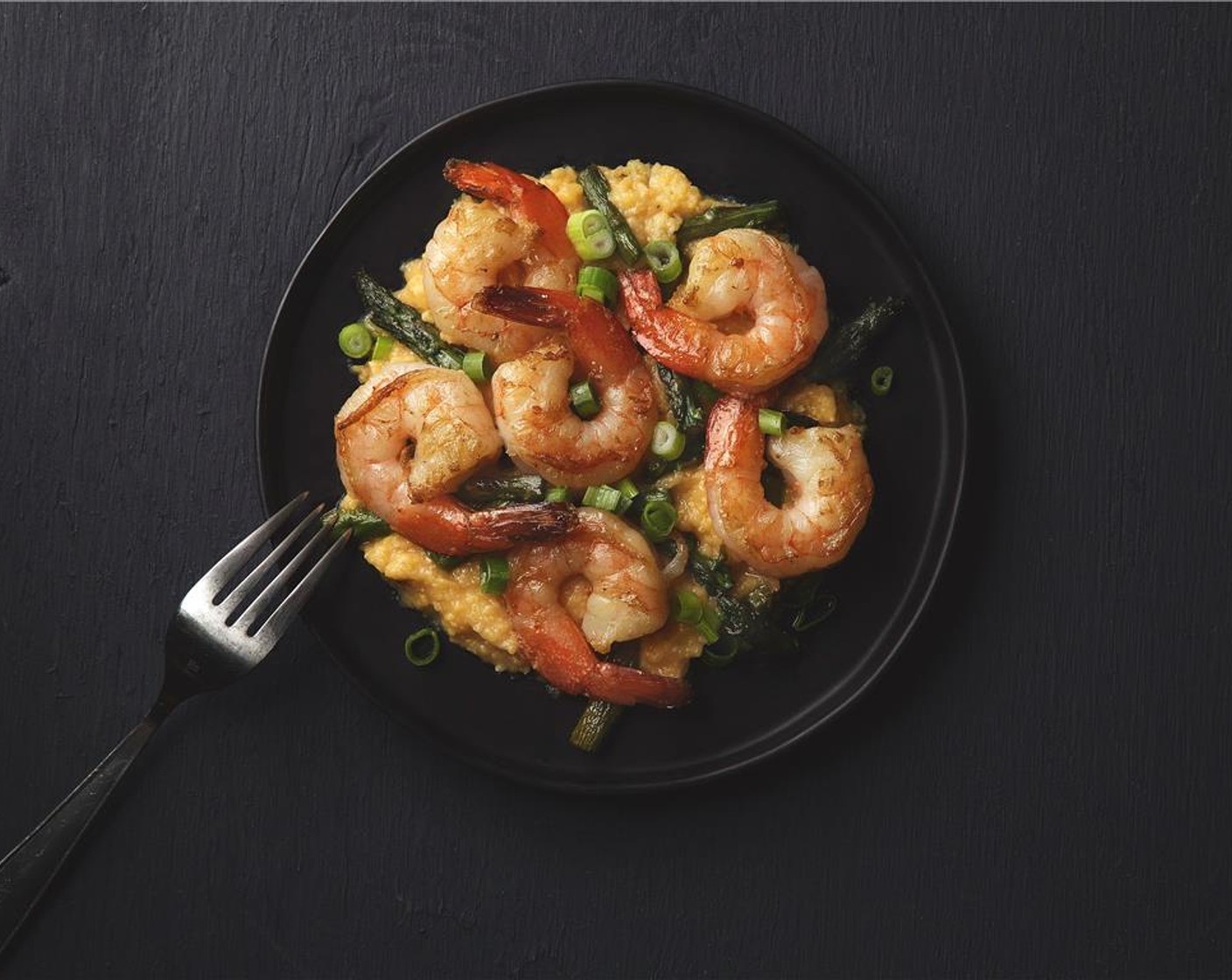 step 9 Place grits in the center of two plates. Top with the shrimp and asparagus. Garnish with Scallion (1 bunch).