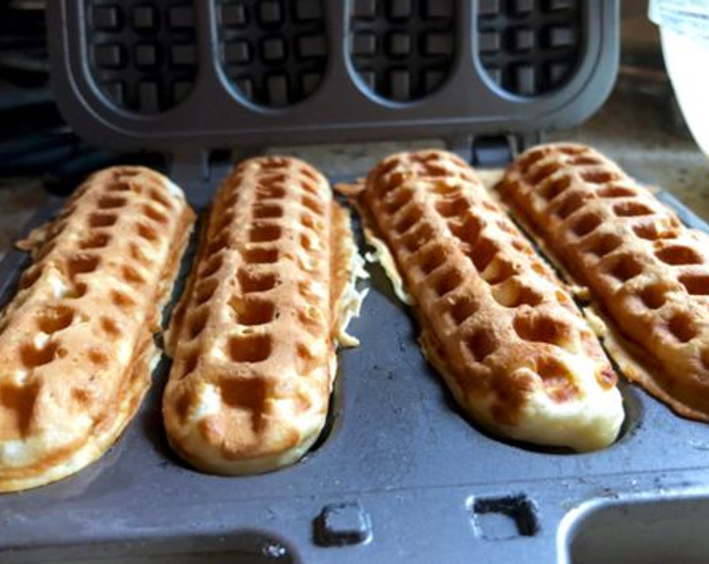step 7 The waffles should take about two to three minutes per side, depending on your stove. The interior surface is nonstick, so the waffles should release from the pan without a problem.