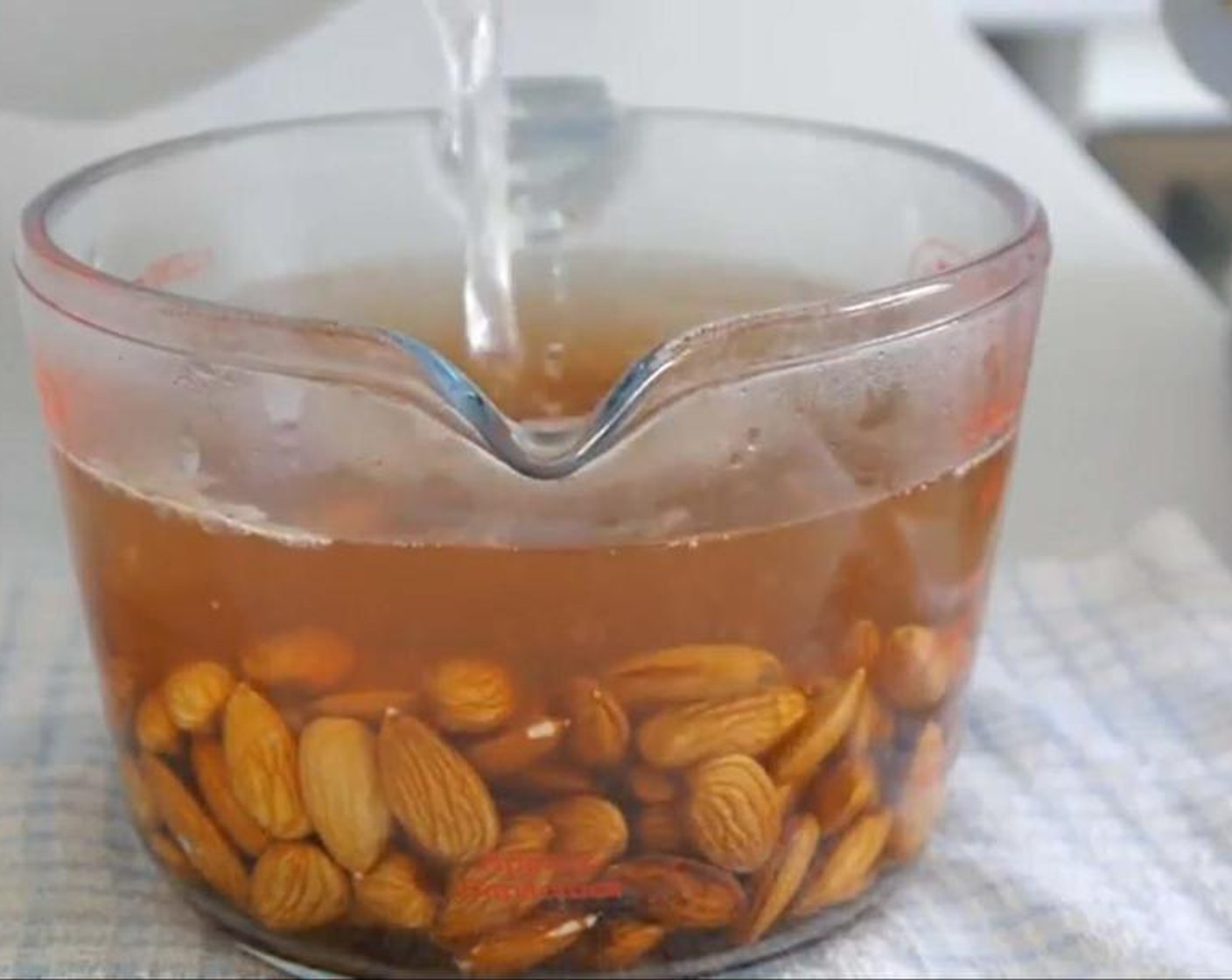step 1 Add the Almonds (2 cups) to a container. Then add Water (to taste) until all almonds are completely covered and soak for 10 minutes.