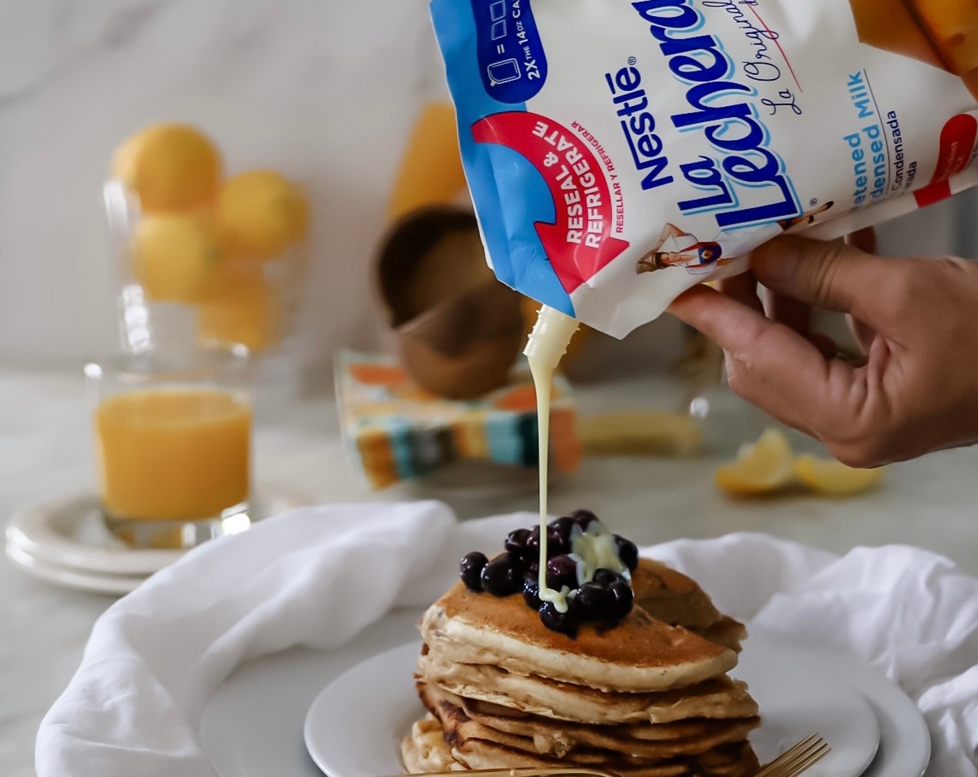 step 6 Serve warm, covered with warm blueberries and Sweetened Condensed Milk Doypacks (to taste).