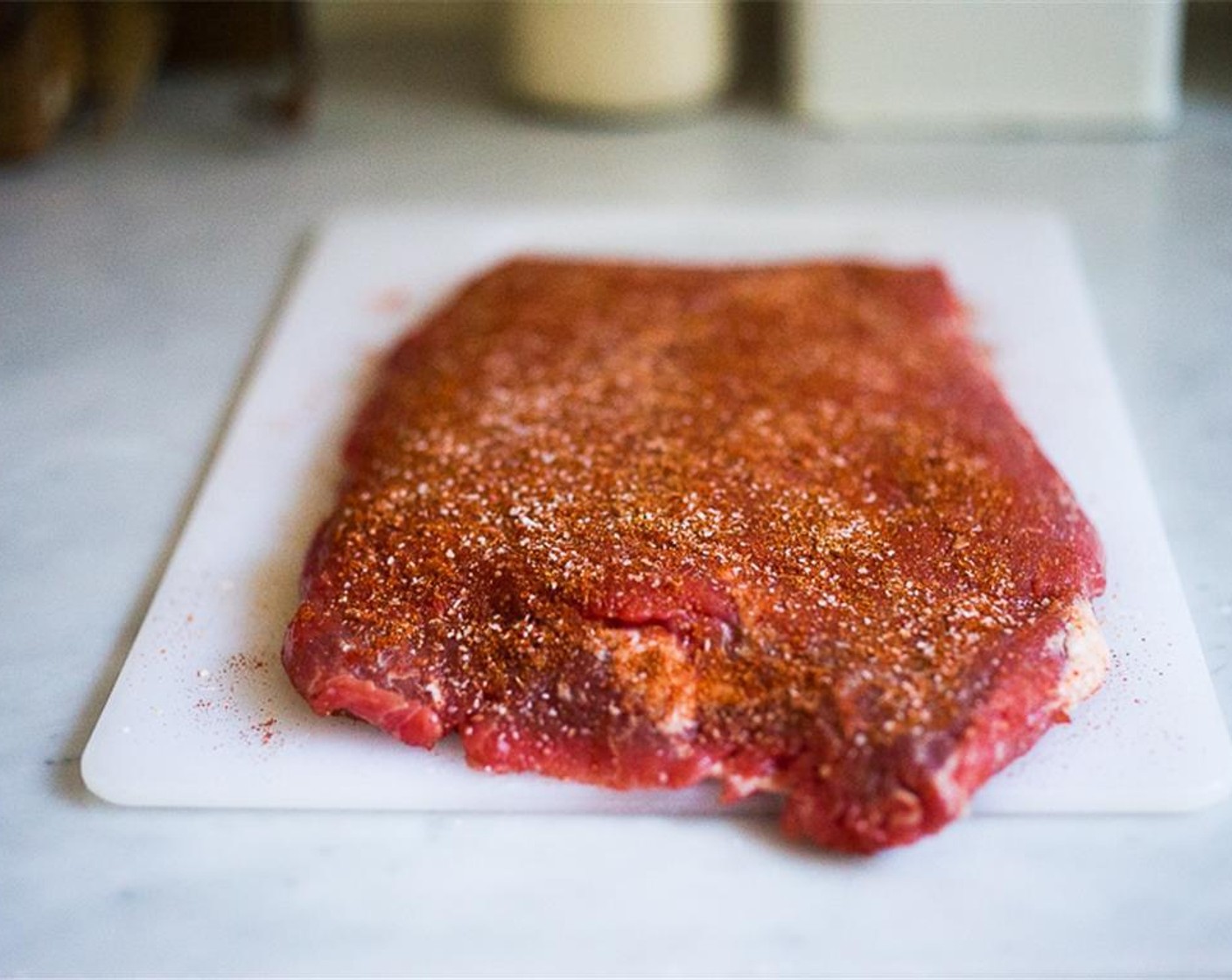 step 2 In a small bowl, mix Kosher Salt (1/2 Tbsp),Ground Cumin (1/2 Tbsp), Smoked Paprika (1/2 Tbsp). Coat both sides of Flank Steak (2 lb) with the spice rub and let sit at room temp while you make the salad or up to 30 minutes.