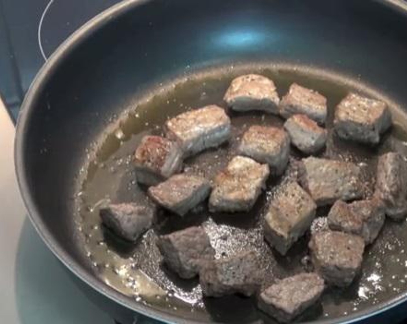 step 2 Chop down the Beef (1.1 lb) into small pieces. Season with Salt (to taste) and Ground Black Pepper (to taste), then fry them inside a pan with some Olive Oil (as needed).