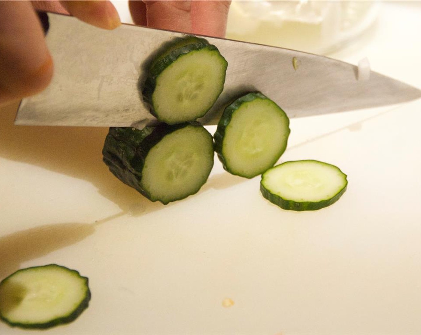 step 5 Cut the Cucumbers (3 1/2 Tbsp) into thick uniform slices. Add the Daikon, Napa Cabbage, garlic, cucumber and red chili into your mason jar.