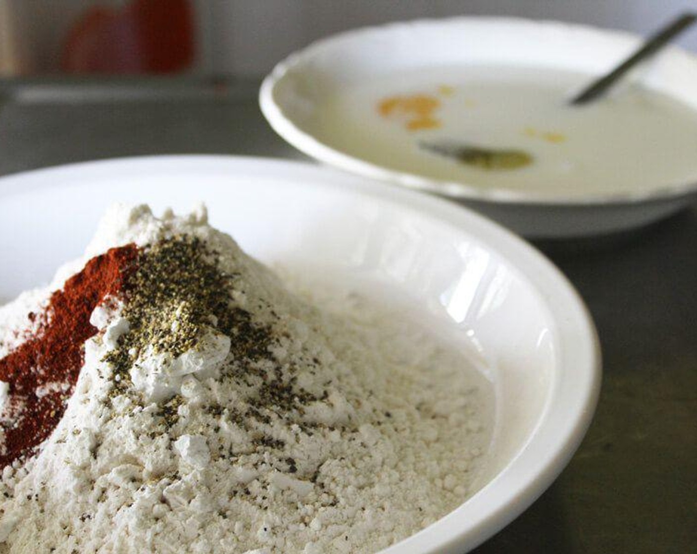 step 2 In a shallow bowl, beat the Egg (1) and stir in the Milk (1/2 cup). In a separate shallow bowl or dish, combine the All-Purpose Flour (1 cup), Cornmeal (3 Tbsp), Powdered Confectioners Sugar (1 Tbsp), Salt (1/8 tsp), Ground Black Pepper (1/8 tsp) and Paprika (1/4 tsp).